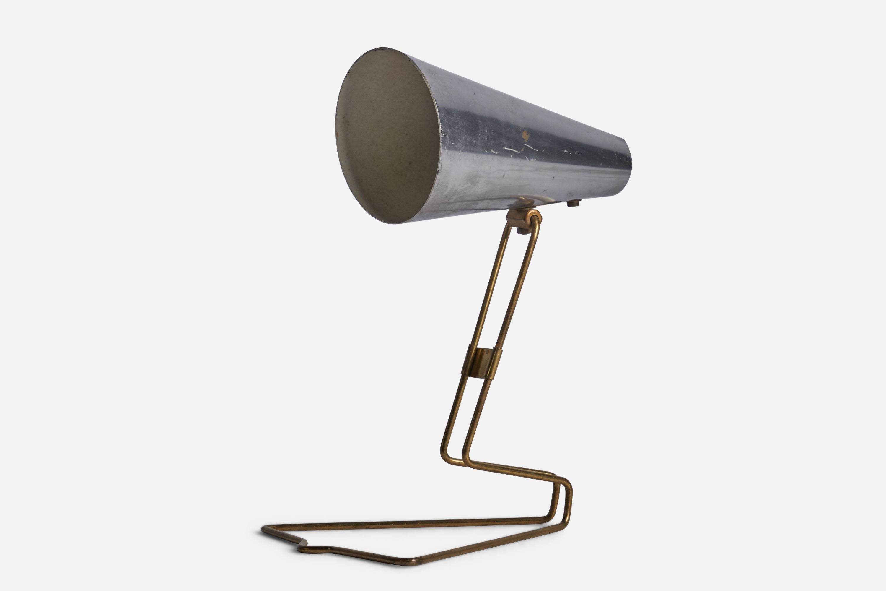 A brass and aluminium table lamp designed and produced by Idman Presenta, Finland, c. 1950s. 

Can be configured as wall light in addition. Please note cord feeds from lampshade.

Overall Dimensions (inches): 8.75” H x 6.5” W x 7.5” D
Bulb