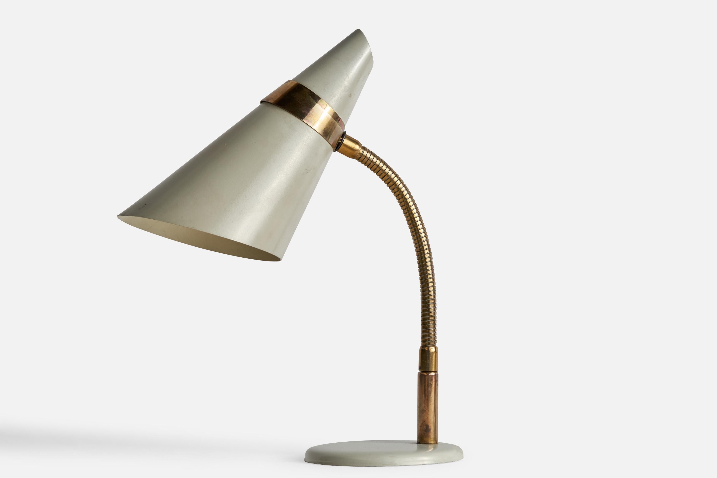 An adjustable brass and grey-lacquered metal table lamp designed and produced by Idman, Finland, 1960s.

Overall Dimensions (inches): 13” H x 5” Diameter 
Bulb Specifications: E-26 Bulb
Number of Sockets: 1
All lighting will be converted for US