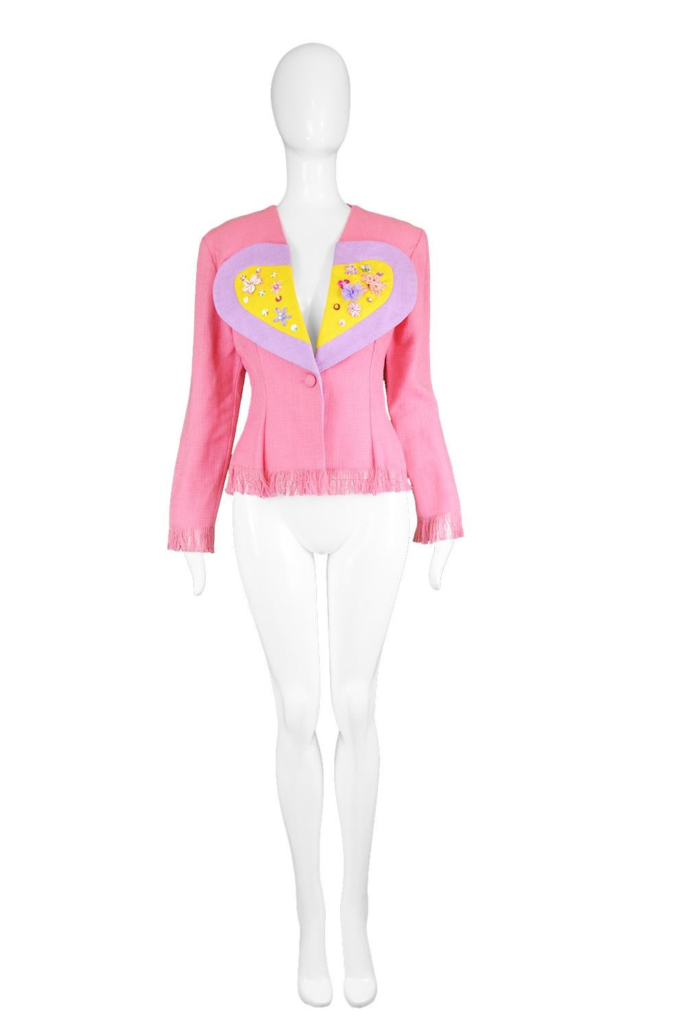 A super cute vintage jacket from the 90s by high quality British boutique label, Idol. In a bubblegum pink woven viscose (rayon) and linen fabric with yellow and light purple lapels that are shaped like a loveheart and embellished with beads, shells
