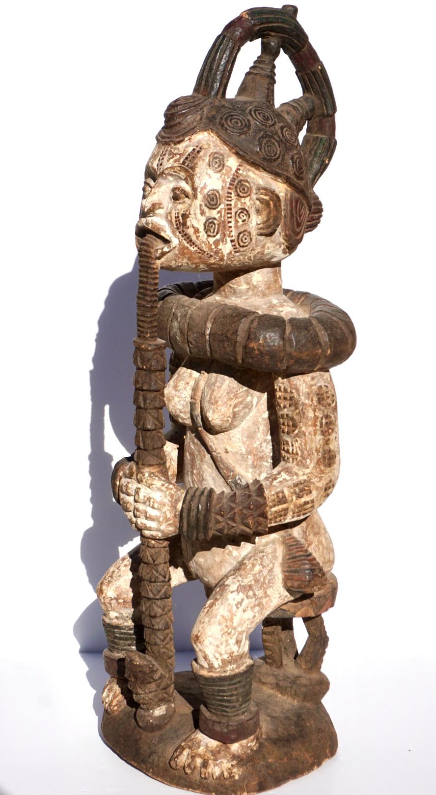 Early 20th Century Idoma Ido Nigerian Carved Wood Figure Of A Seated Female  For Sale
