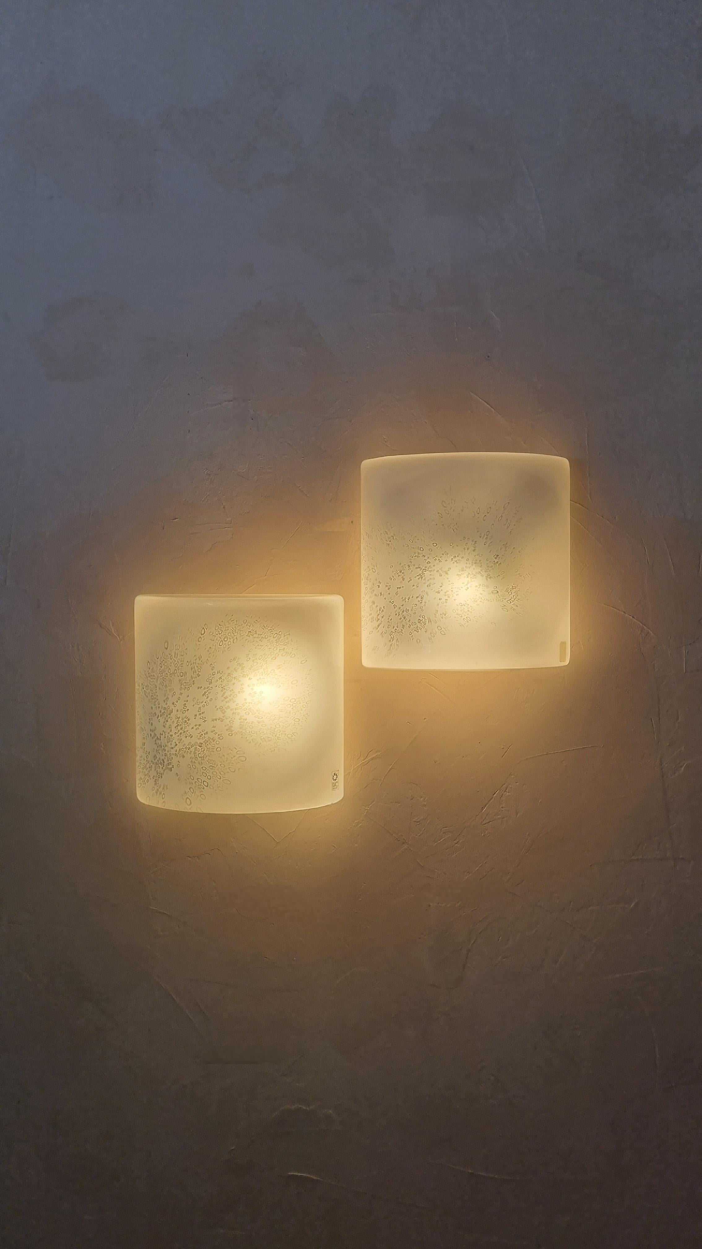 Set of 2  Idra wall sconces designed by Rosanna Toso in the 70s, painted metal structure, Murano glass diffusers, two light points, mounting E 27 bulbs.
Excellent conditions, new electric plant, perfectly working.
Bibliography:
Leucos lighting