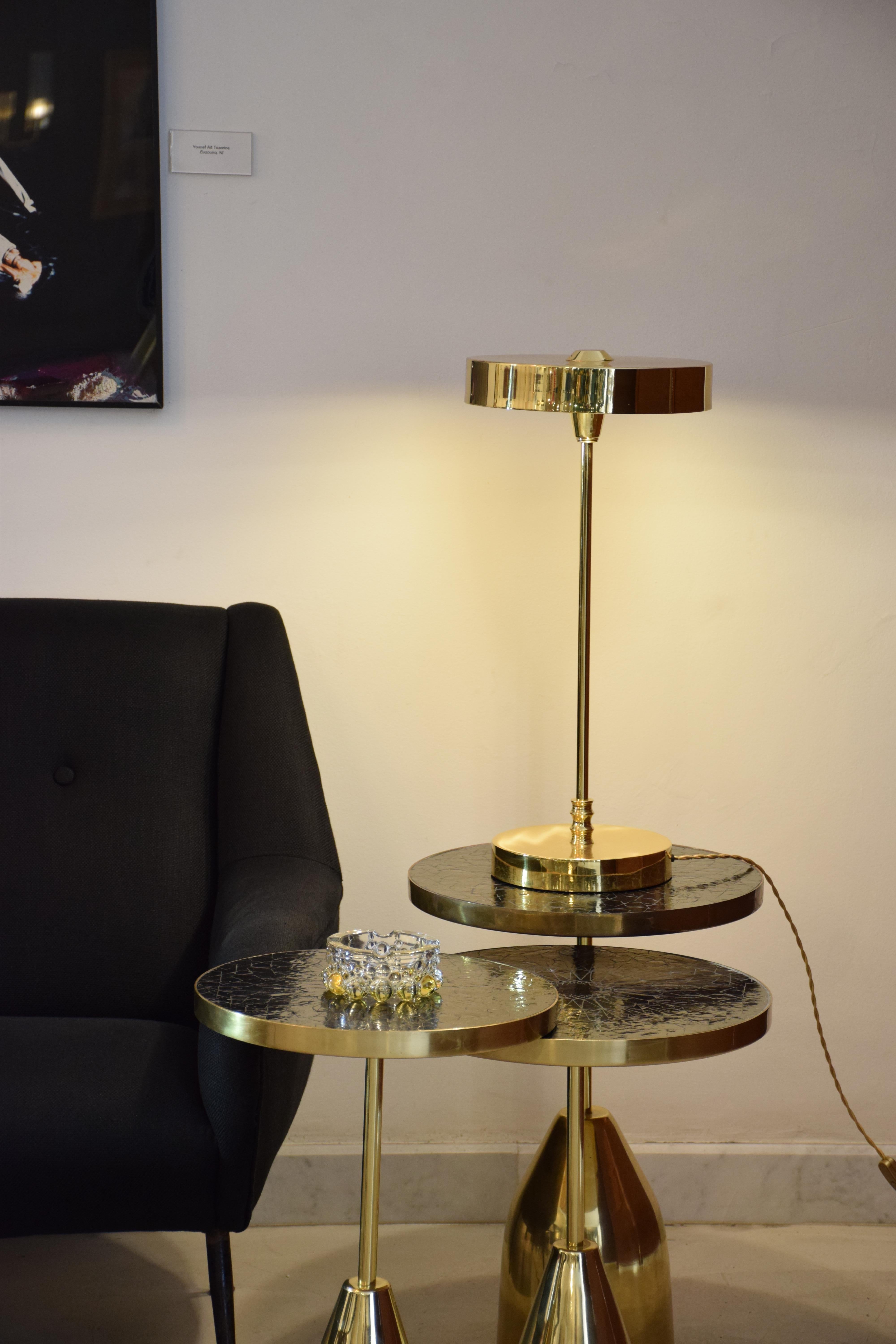 A minimalistic LED brass lamp highlighted by its disc base and shade which di uses light from the bottom. Perfect for reading, as a desk or an accent lamp.

Flow 2 by JA Studio
The inspiration behind this collection was to create modern designs with