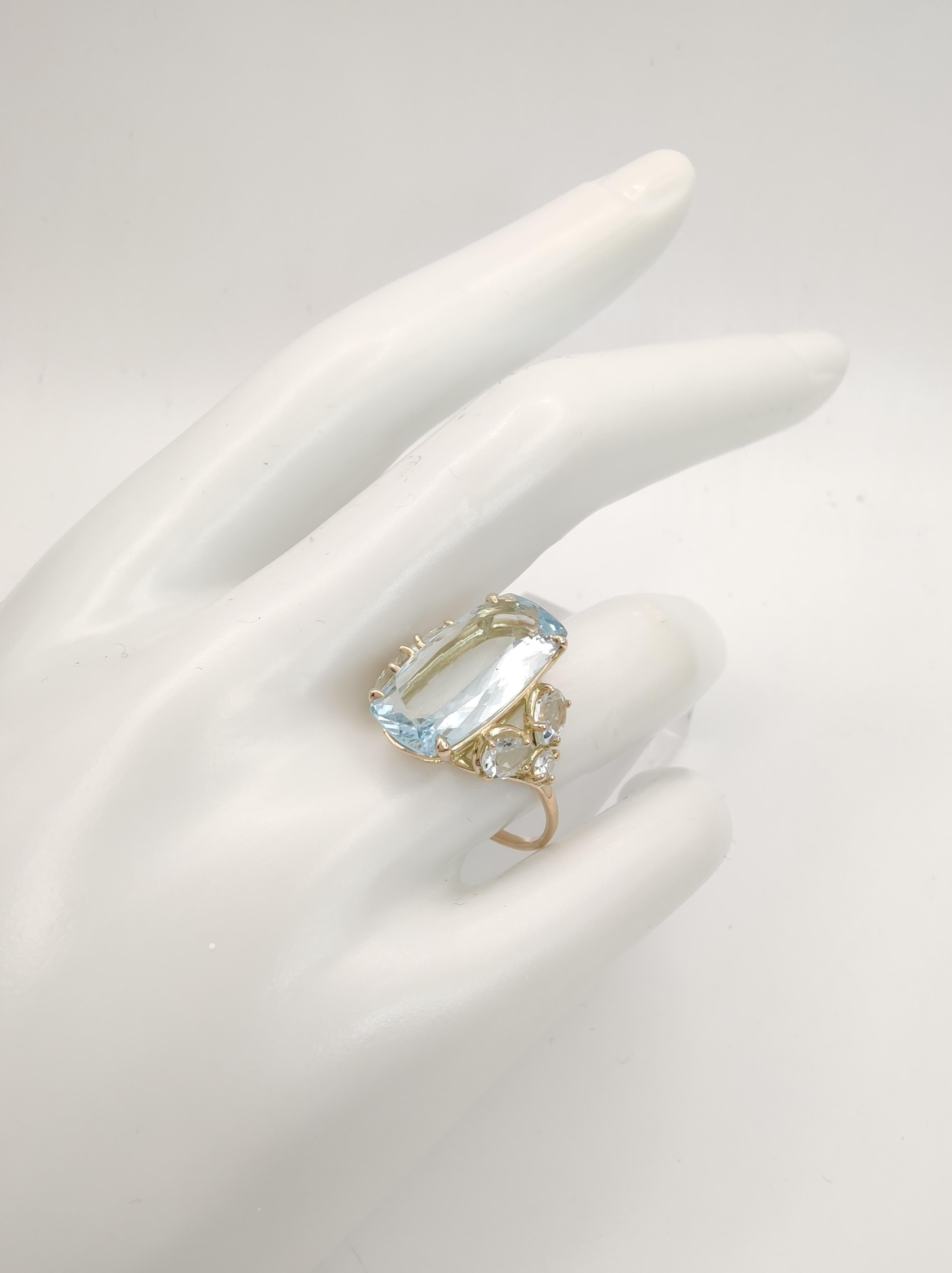 Discover a handmade, sculptural masterpiece a unique ring perfect for engagement, promise, wedding, or a special Christmas gift for that extraordinary woman in your life. Featuring a stunning central Aquamarine gem framed by exquisite side