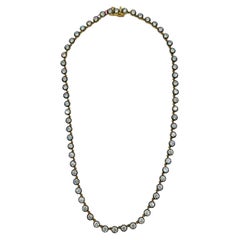 IGI Collar de diamantes redondos de 0,20 quilates cada uno en oro amarillo de 18 quilates y rodio negro