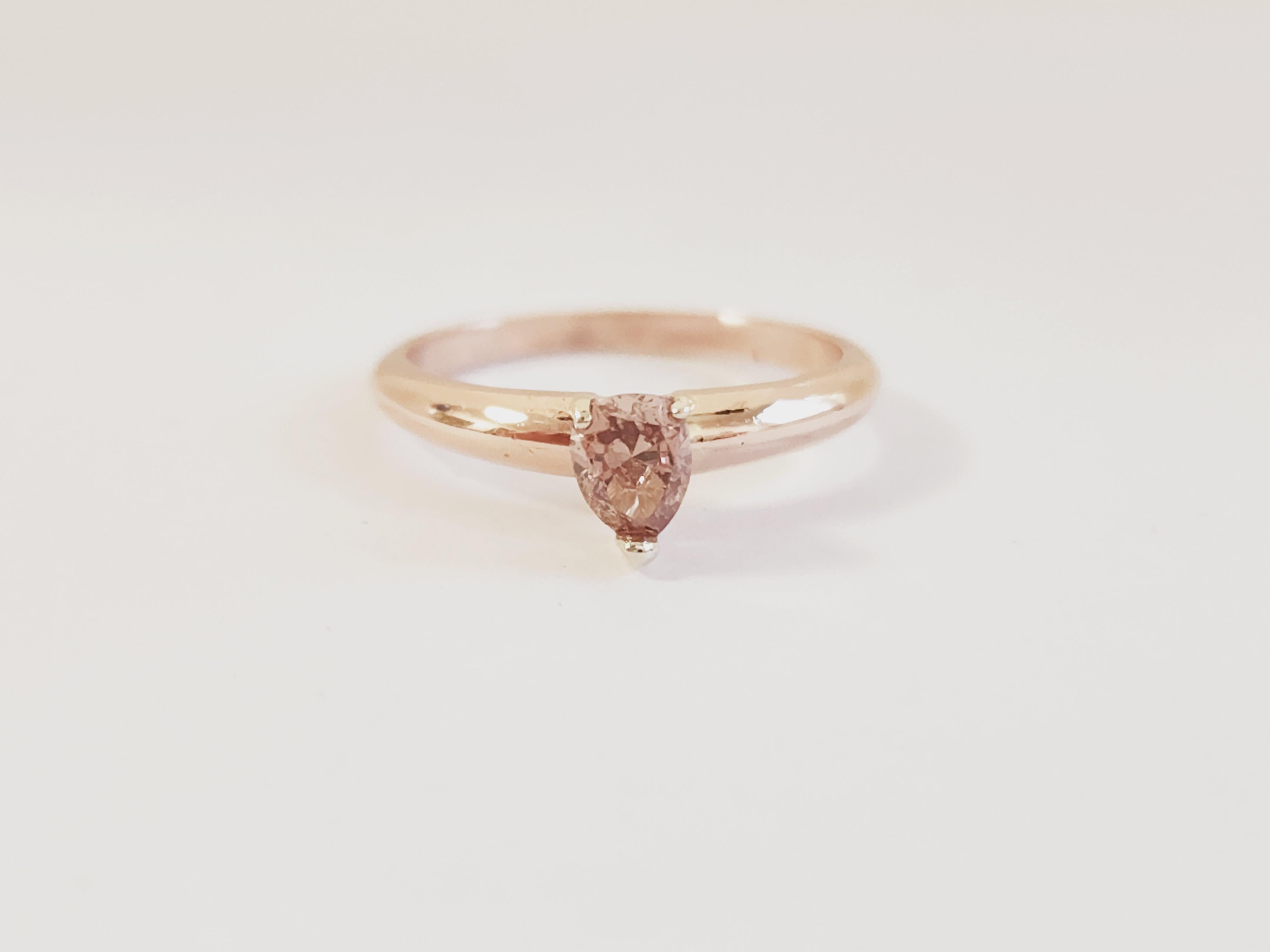 Natural fancy brownish pink pear shape diamond weighing 0.30 carats. Set on 14 Karat Rose Gold Size 5