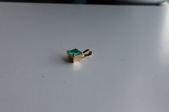 IGI 0.5Ct Colombian emerald pendant in 18K Yellow Gold
