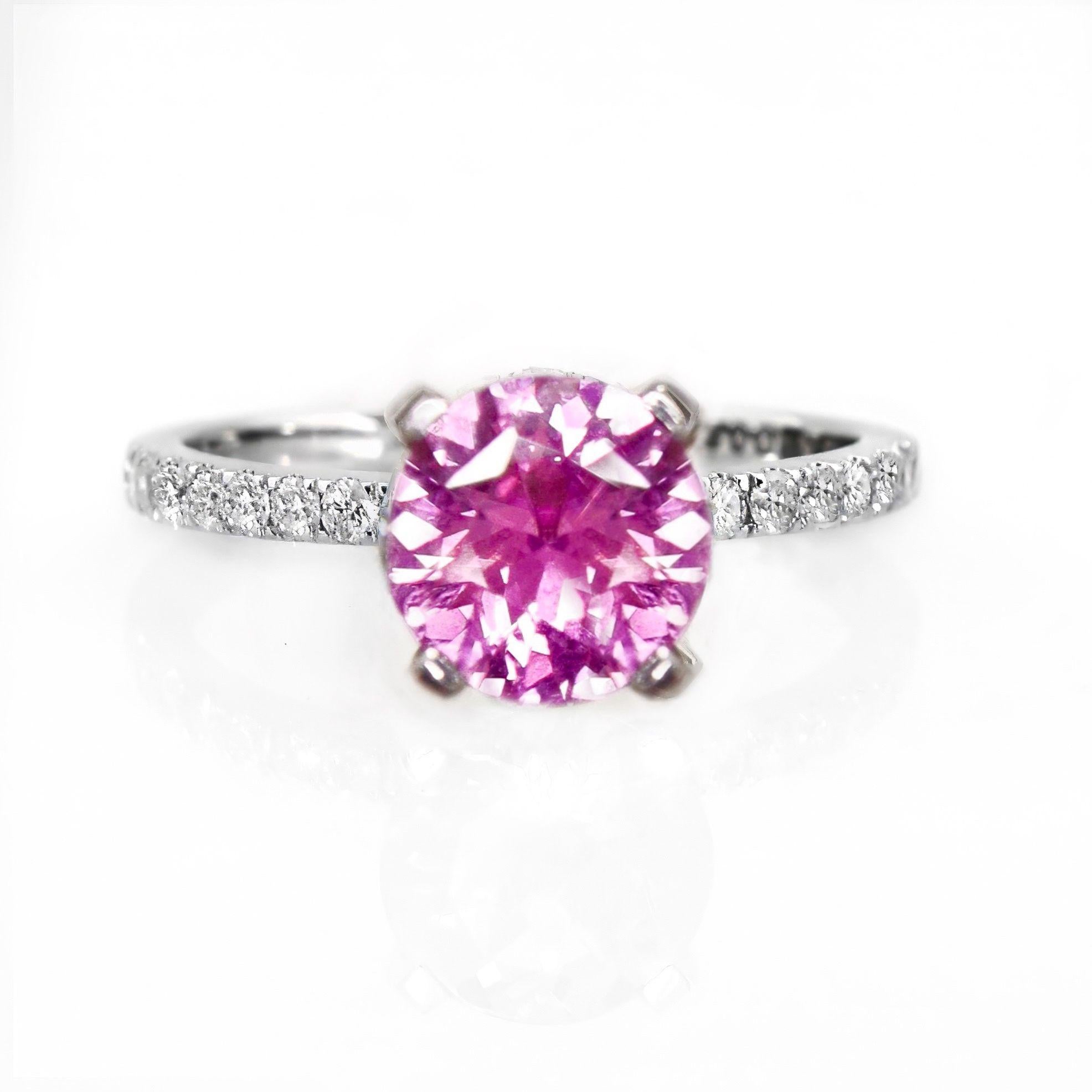 *IGI 1.03 Ct 14K White Gold Pink Sapphire&Diamonds Engagement Ring*

IGI-certified natural pink sapphire weighing 1.03 ct set on 14K white gold pave' design band with natural F-G, VS diamonds weighing 0.25 ct.  

The ring combines fashion and