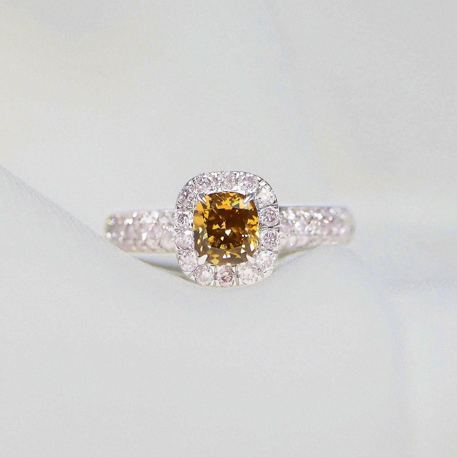*IGI 14K 0.76 Ct Yellow&Pink Diamonds Antique Art Deco Style Engagement Ring*

Natural fancy intense brownish-yellow Diamond weighing 0.76 ct set on the 14K white gold pave' design band with natural round brilliant cut pink diamonds weighing 0.57
