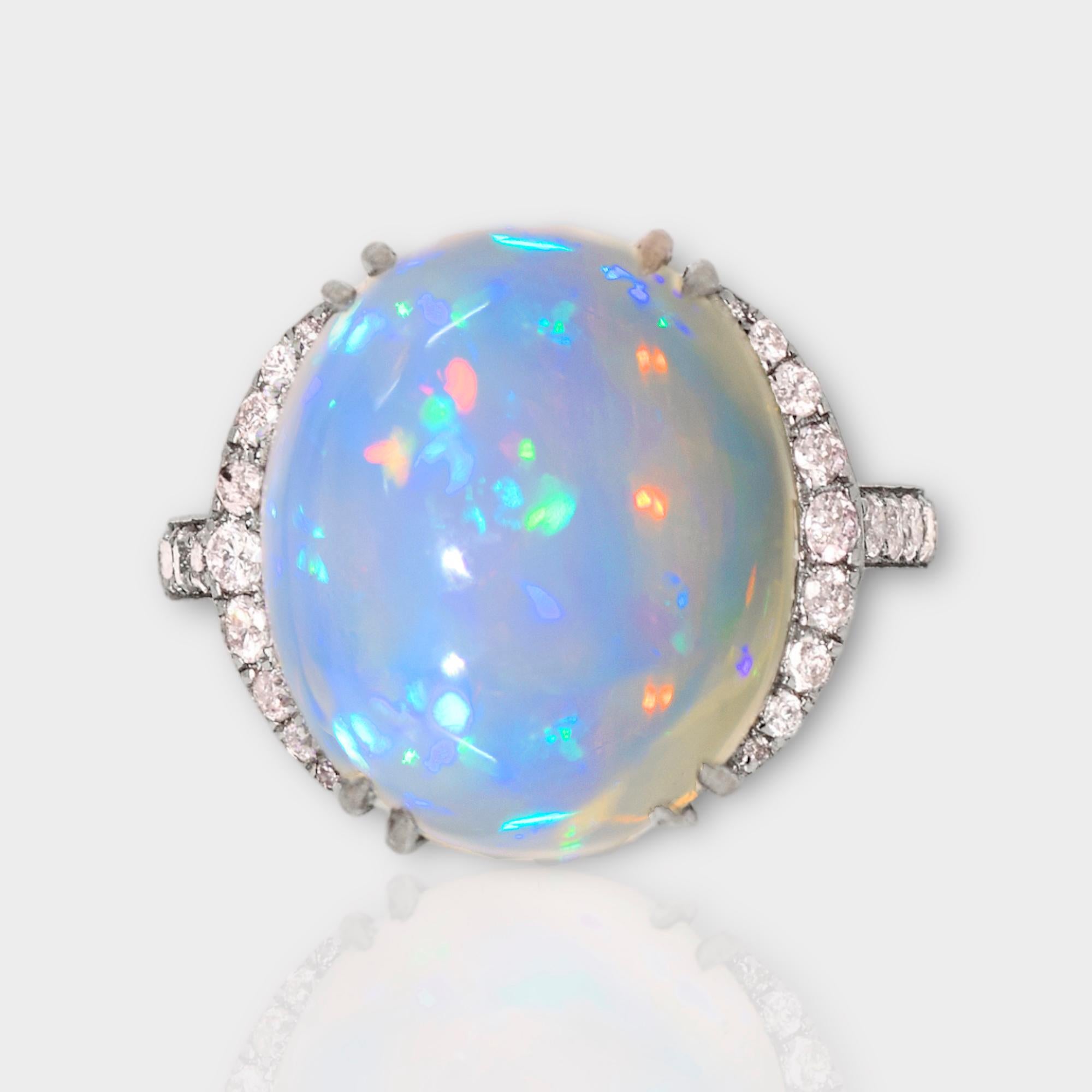 *IGI 14K 10.31 ct  Natural Color Play Opal Diamonds Antique Engagement Ring*
This ring features a 10.31-carat natural white Opal with a color-play effect. It is set on a 14K white gold band and accented with natural pink diamonds weighing 0.51