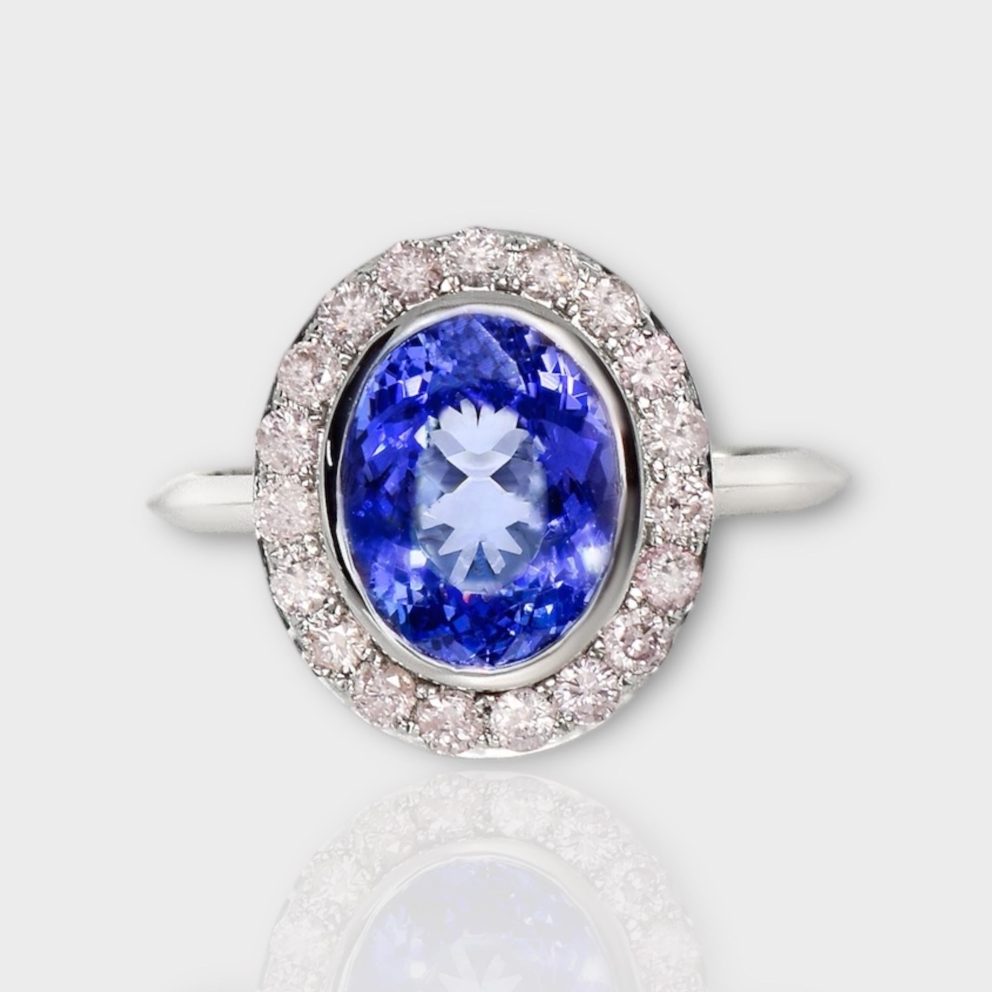*IGI 14K 2.88 ct Tanzanite&Pink Diamond Antique Art Deco Style Engagement Ring*
The natural intense bluish violet tanzanite, weighing 2.88 ct, is the center stone surrounded by natural pink diamonds weighing 0.44 ct on the 14K white gold halo design