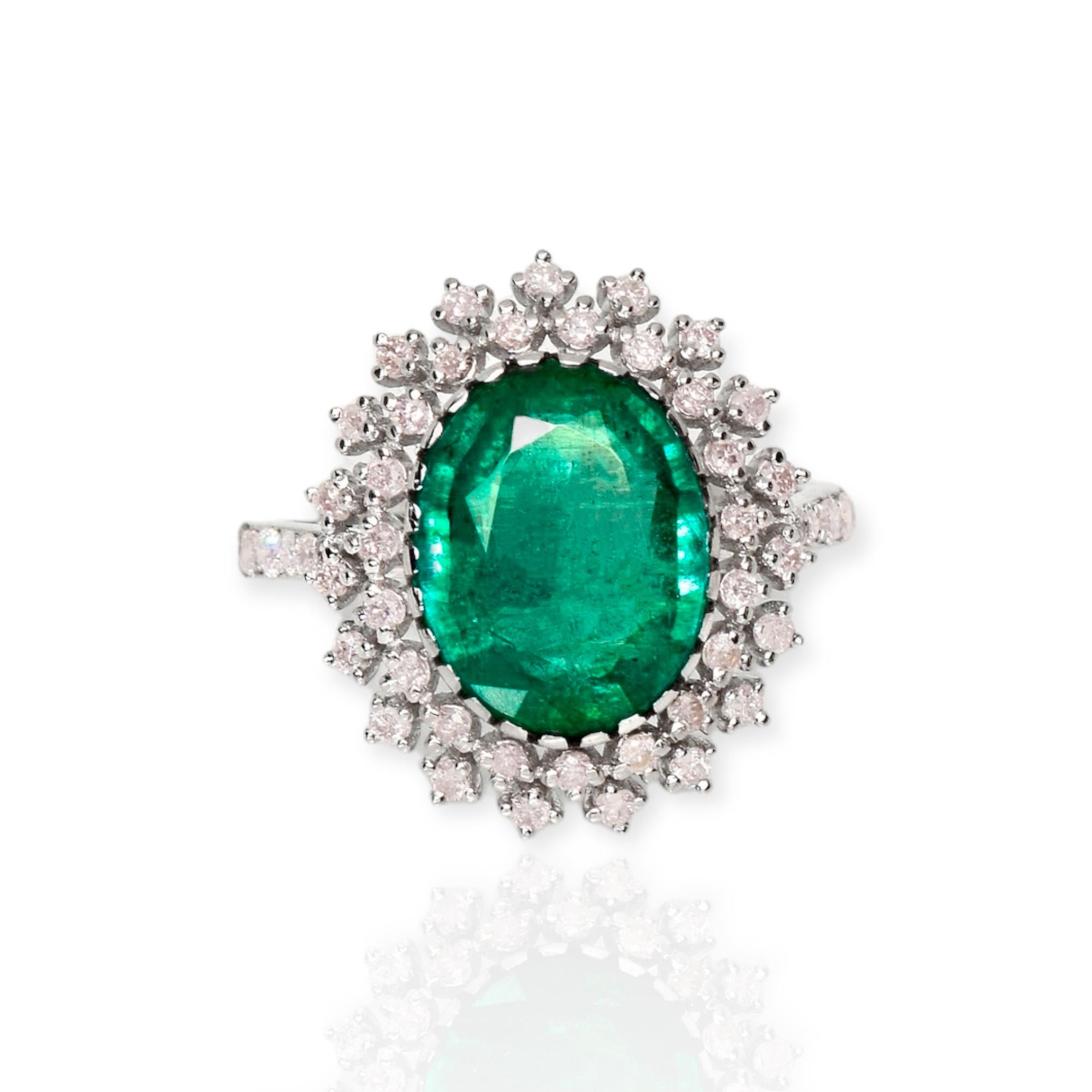 **IGI 14K White Gold 3.33 ct Emerald&Pink Diamonds Antique Art Deco Style Engagement Ring** 

An IGI-certified natural Zambia green emerald weighing 3.33 ct is set on an 14K white gold arc deco design band with natural pink diamonds weighing 0.66
