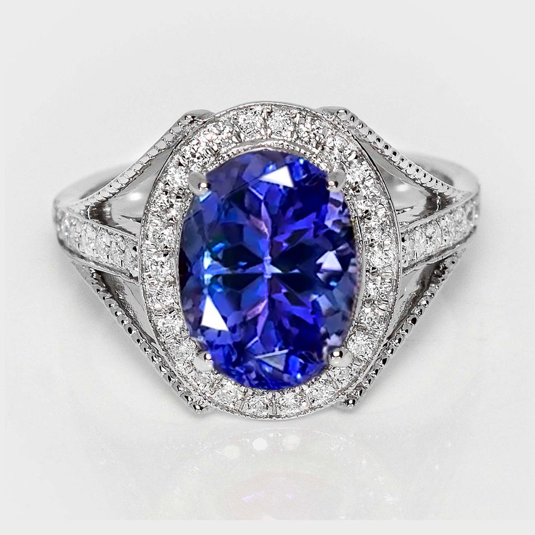 *IGI 14K 3.62 Ct Natural Tanzanite&Diamonds Anillo de Compromiso Antiguo*

Una tanzanita natural vívida azul-violeta certificada por el IGI de 3,62 quilates engastada en una lujosa banda de oro blanco de 14 quilates con diseño de mesa y diamantes