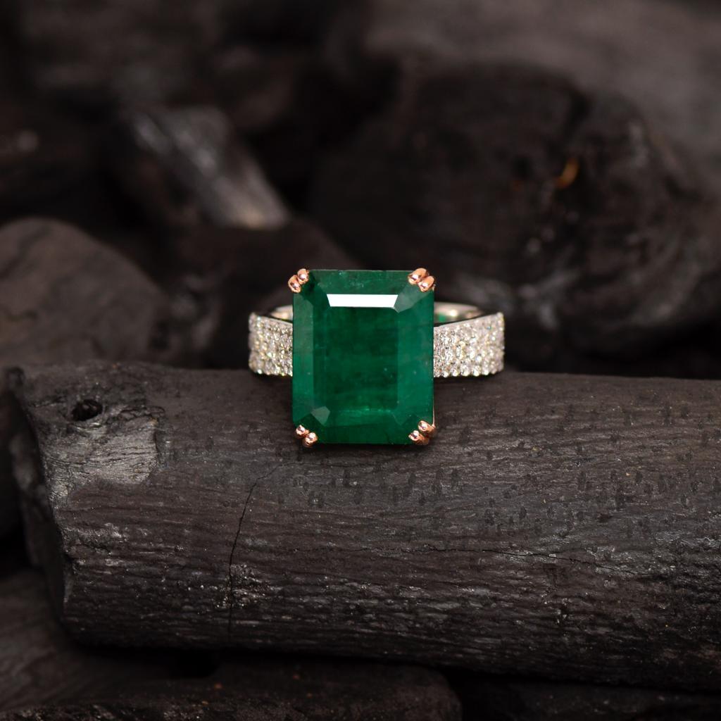 **One 14K White Gold 7.99 Ct Emerald⋄ Ring**
A natural deep green color Emerald weighing 7.99 ct set on a pave' 14K white gold band weighing 0.55 ct FG VS graded accent diamonds. 

The fashion luxurious design makes the ring suitable for wearing on