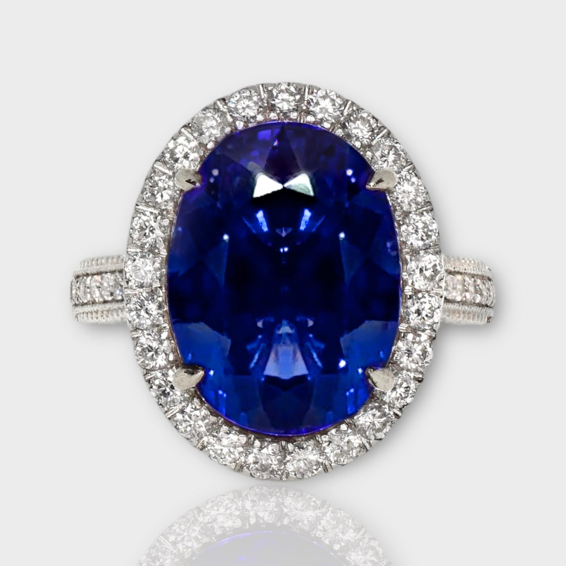 *IGI 18K White Gold Vivid 10.19 Ct Tanzanite&Diamonds Engagement Ring**

One IGI-Certified natural top-quality vivid blue Tanzanite as the center stone weighing 10.19 ct
surrounding by the FG VS accent diamonds weighing 0.75 ct to make the ring more