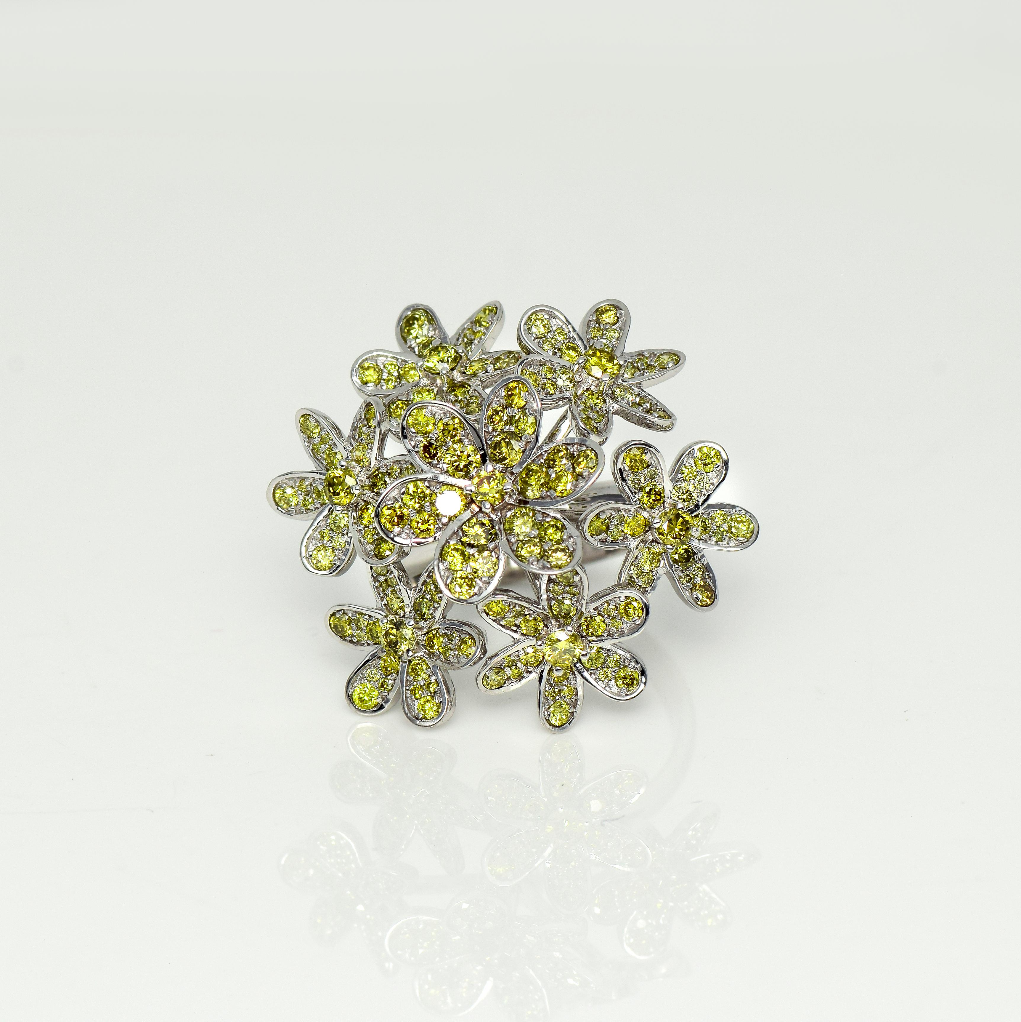 *IGI 18K 2.06 Ct Natural Greenish Yellow Diamonds Flowers Cocktail Ring*

IGI-certified 6 isolated flowers with 169 pieces of fancy intense greenish yellow diamonds weighing 2.06 ct on the 18K white gold band, and the total ring weight is 9.18 grams