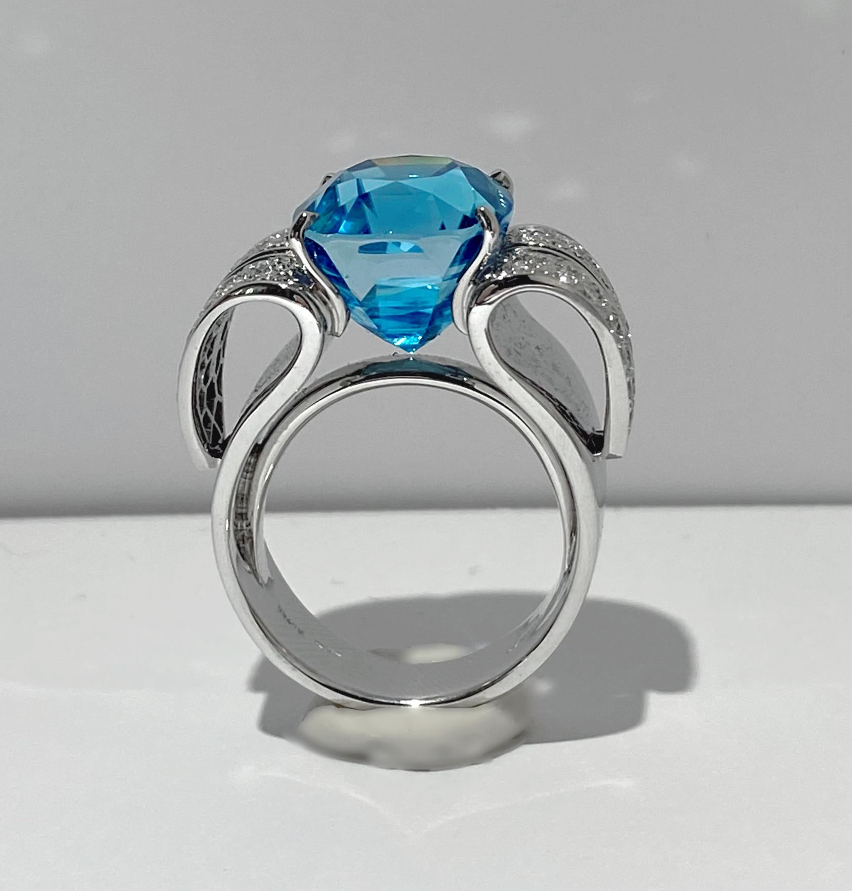 Nature's tender embrace is elegantly embodied in this exquisite ring crafted by the master Italian jeweler, Scavia. The captivating design features two pavé diamond petals delicately cradling a rare and breathtaking Light Blue Zircon weighing 3.29