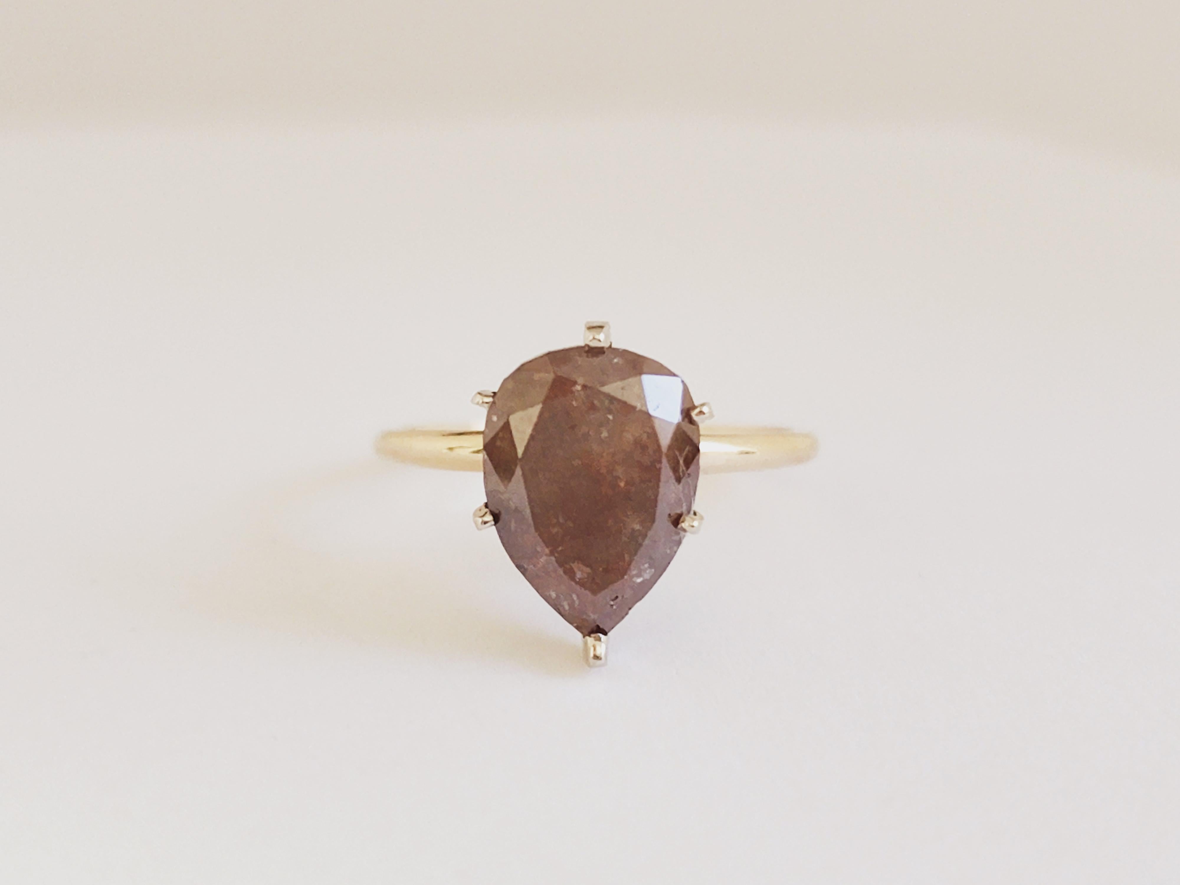 IGI Pear Shape Brown Diamond Weighs 3.89 Carats. 
Ring size 6.75 can be resize.
Color: Natural Brown