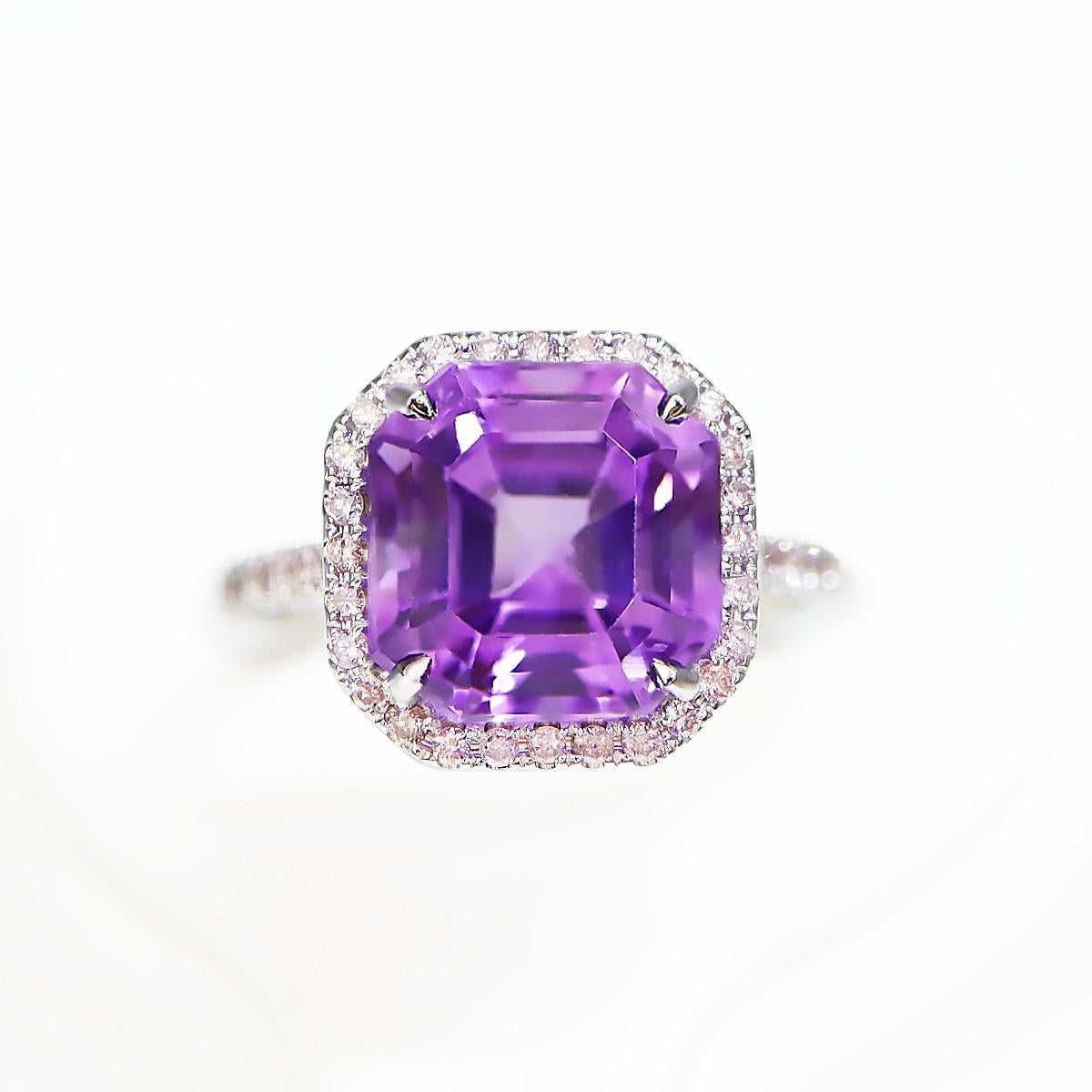 *IGI 14K 5.00 ct Amethyst&0.34 Ct Pink Diamond Antique Engagement Ring*
The natural intense purple Amethyst, weighing 5.00 ct, is the center stone surrounded by natural pink diamonds weighing 0.34 ct on the 14K white gold halo design band.

The