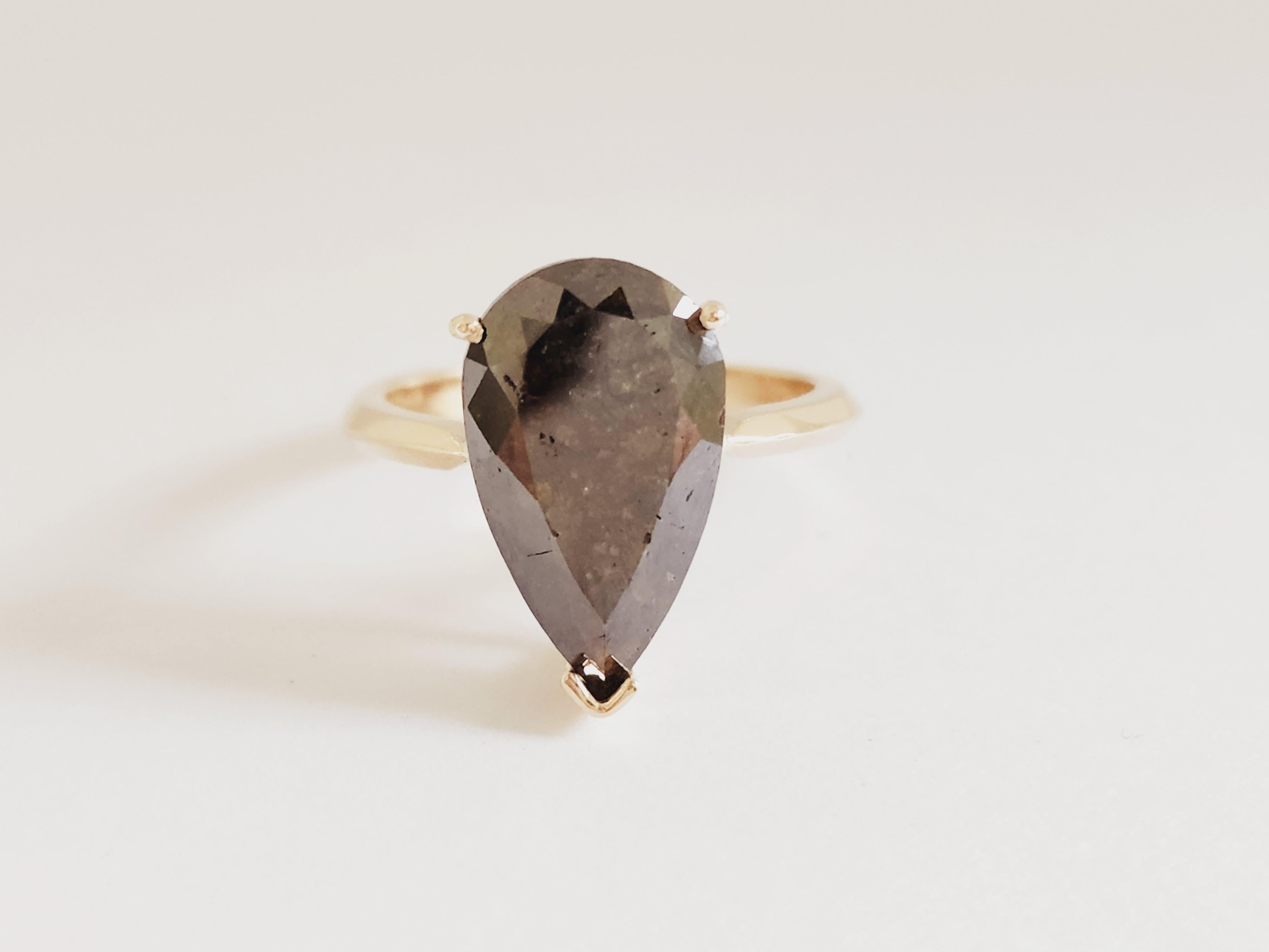 IGI Pear Shape Dark Green Diamond Weighs 5.84 Carats. 
Ring size 7 can be resize.
3 Prong Setting