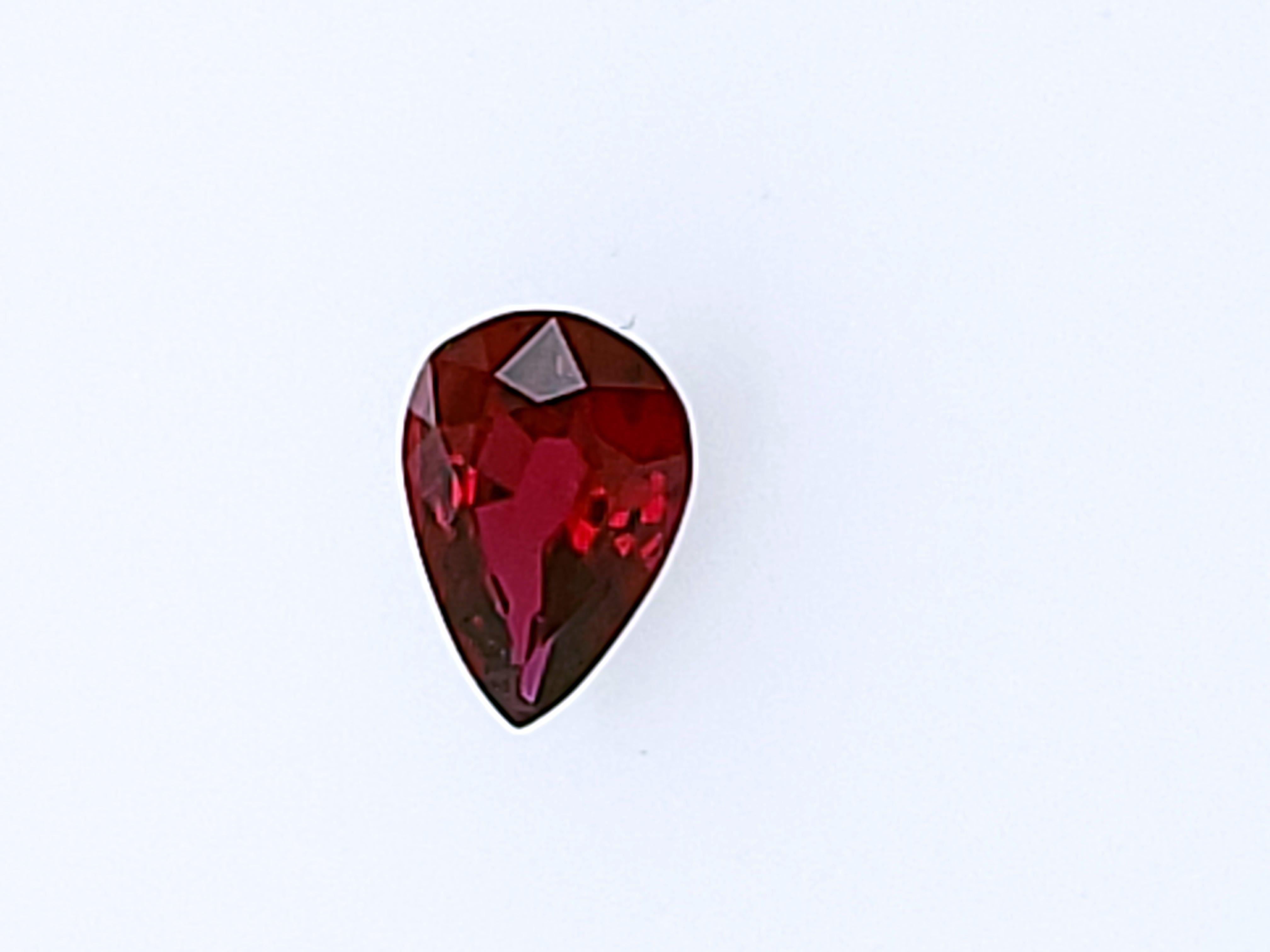 Here is another wonderful buy/purchase for someone looking for a Nice NATURAL Red Ruby!   This has been tucked away in our vaults for essentially 40 years.  

This is a pear shaped, 0.49ct (essentially half a carat!) Ruby, certed by  the