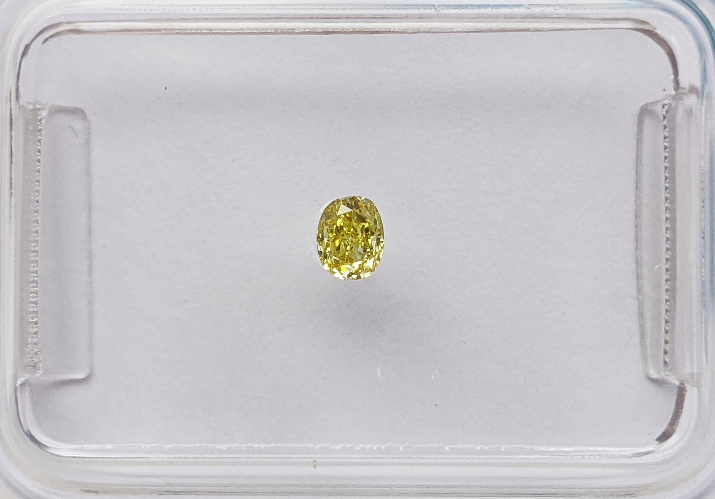 Here's an exquisite 0.11ct Oval Modified Brilliant diamond, certified by IGI. Its mesmerizing Fancy Vivid Greyish Yellow hue is a rare delight, exuding sophistication. With a reliable VS2 clarity, this diamond captures attention with both beauty and