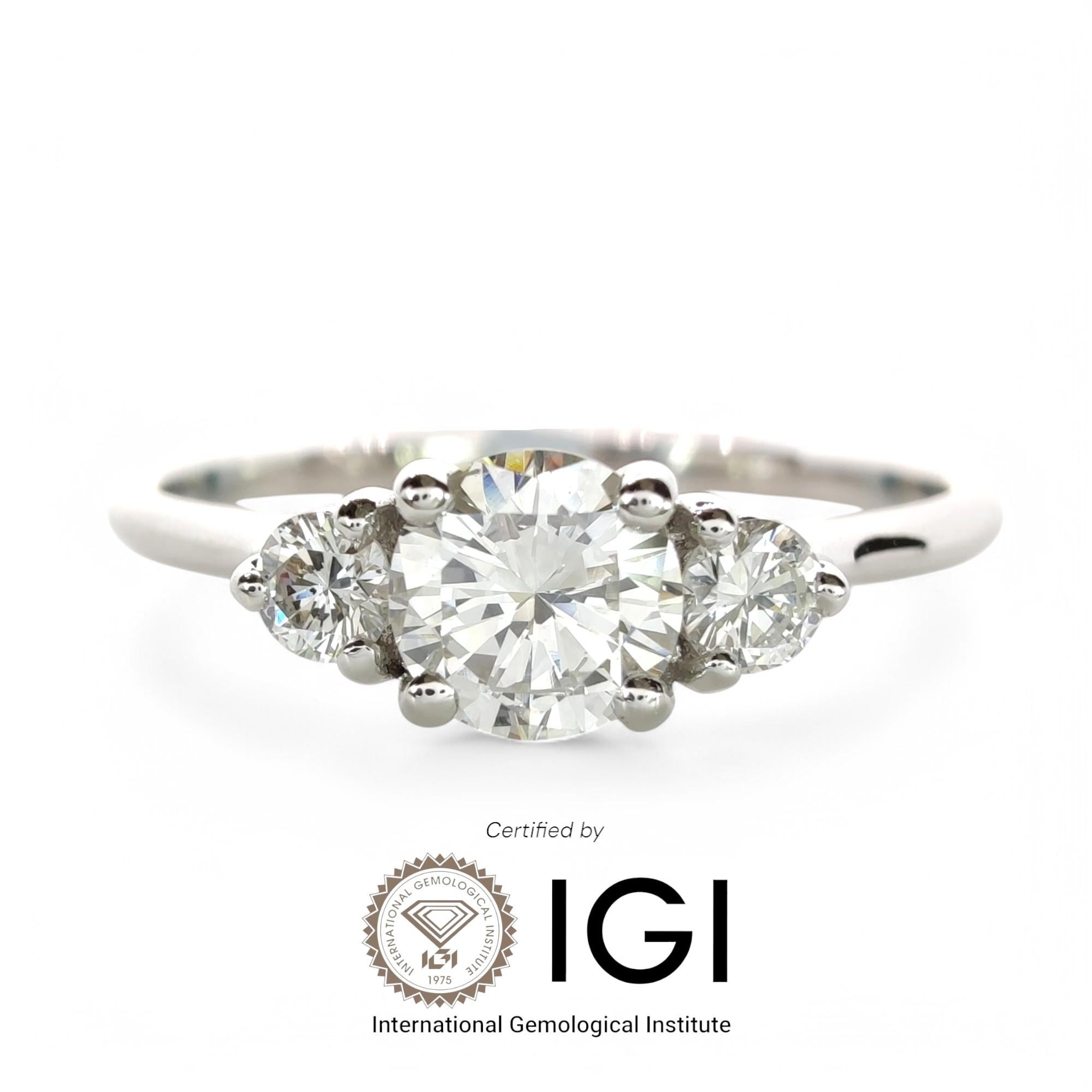 
Diamond Details:
    Total Carat Weight: 0.45ct

    Center Diamond:
        Cut:  Round Brilliant
        Dimensions: 4.60 x 4.66 x 2.70 mm
        Estimated Weight: 0.35ct
        Color: E-F 
        Clarity: VS2 
        Finish: Good

    Side