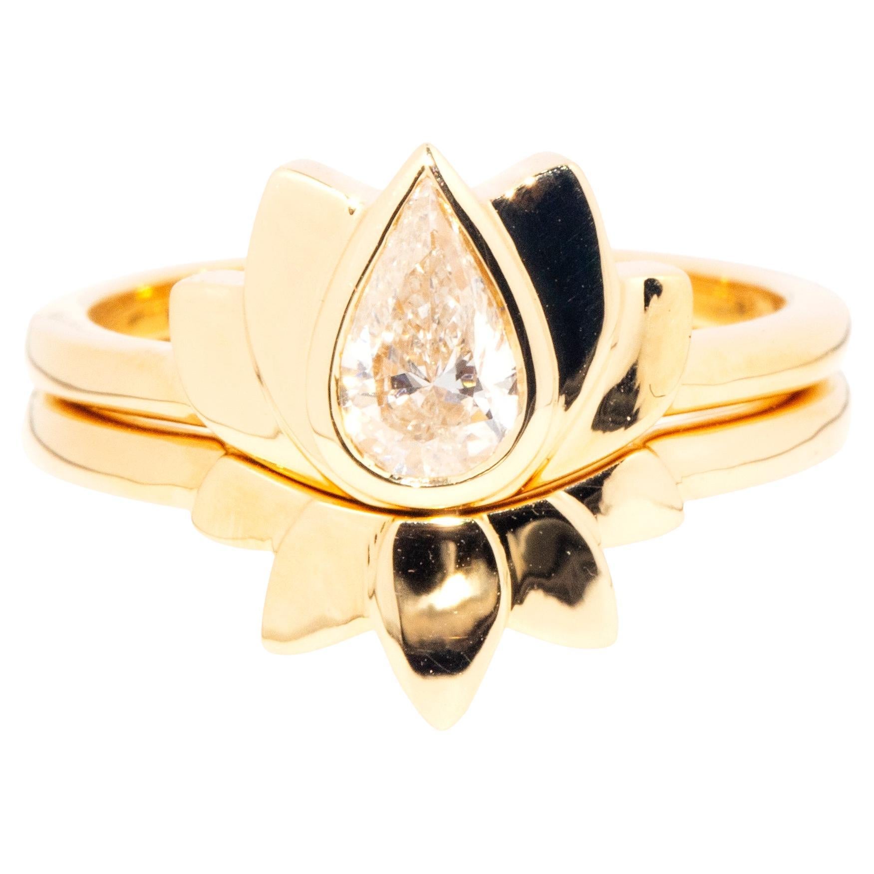 IGI Certified 0.52 Carat Pear Cut Diamond 18 Carat Gold Lotus Two Ring Set For Sale