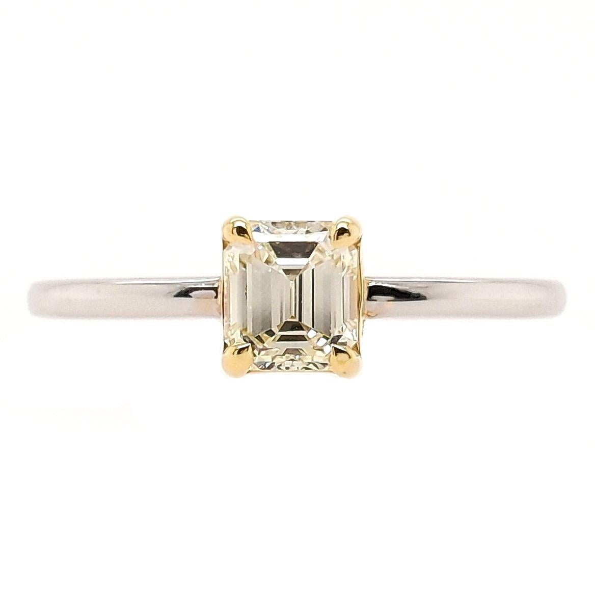 This is a gorgeous natural light-yellow diamond ring with VS clarity in emerald-cut shape. This special ring made of 14K yellow & white gold, has a classic appeal that will never go out of style.

This ring is certified by IGI laboratory, report