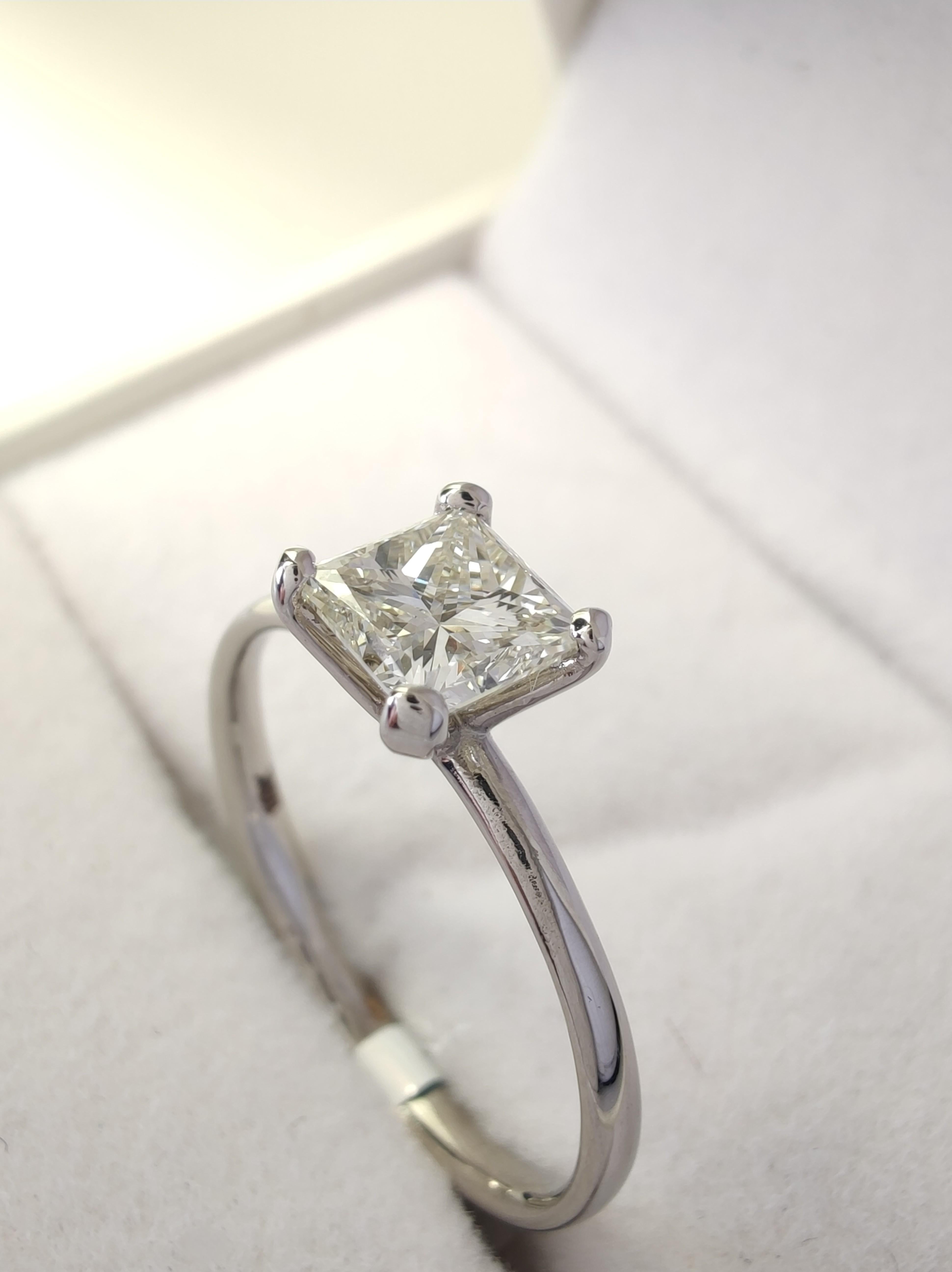 Size (Resizable at no cost)
US 7
UK N½
EU 54

Experience the perfect proposal with this IGI-certified diamond engagement ring. Featuring a 0.76ct princess-cut diamond set in 18K white gold, with J-K color and VS2 clarity. Handcrafted with a unique