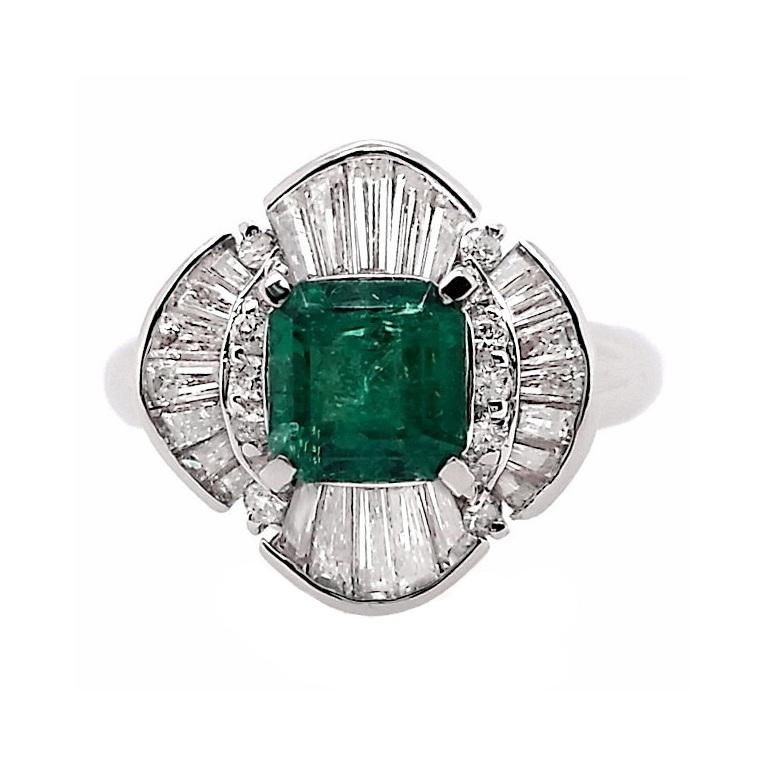 Immerse yourself in opulence with this resplendent square Colombian emerald platinum ring, with amazing vivid-bluish-green color, adorned with exquisite natural diamonds. A paragon of sophistication, this heirloom-worthy masterpiece exudes
