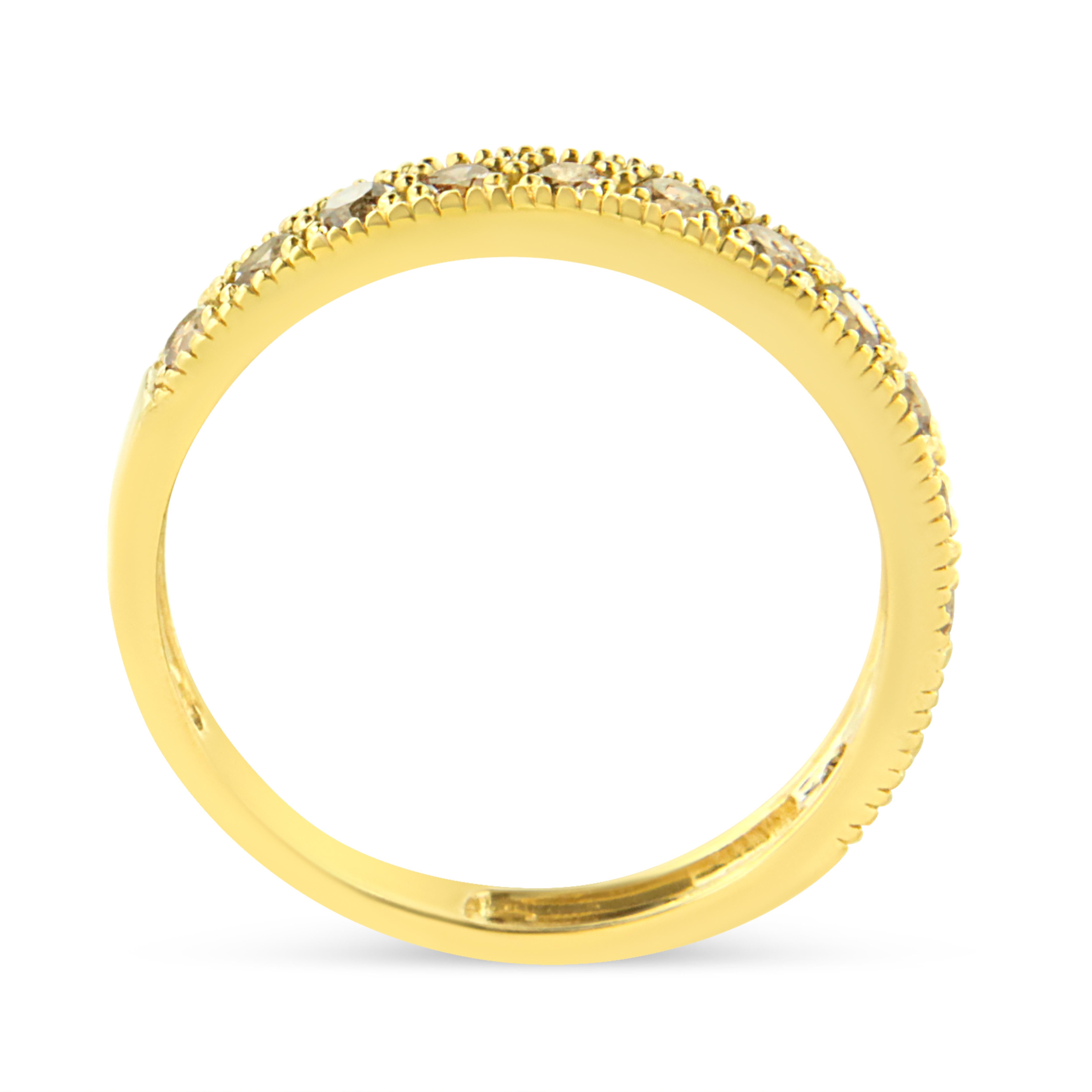 Elegant and timeless, this IGI certified 10K yellow gold diamond band features 0.5 carat total weight of round diamonds pave set into the face of the slender band. Each diamond is surrounded by multiple prongs which mimic the appearance of diamonds.