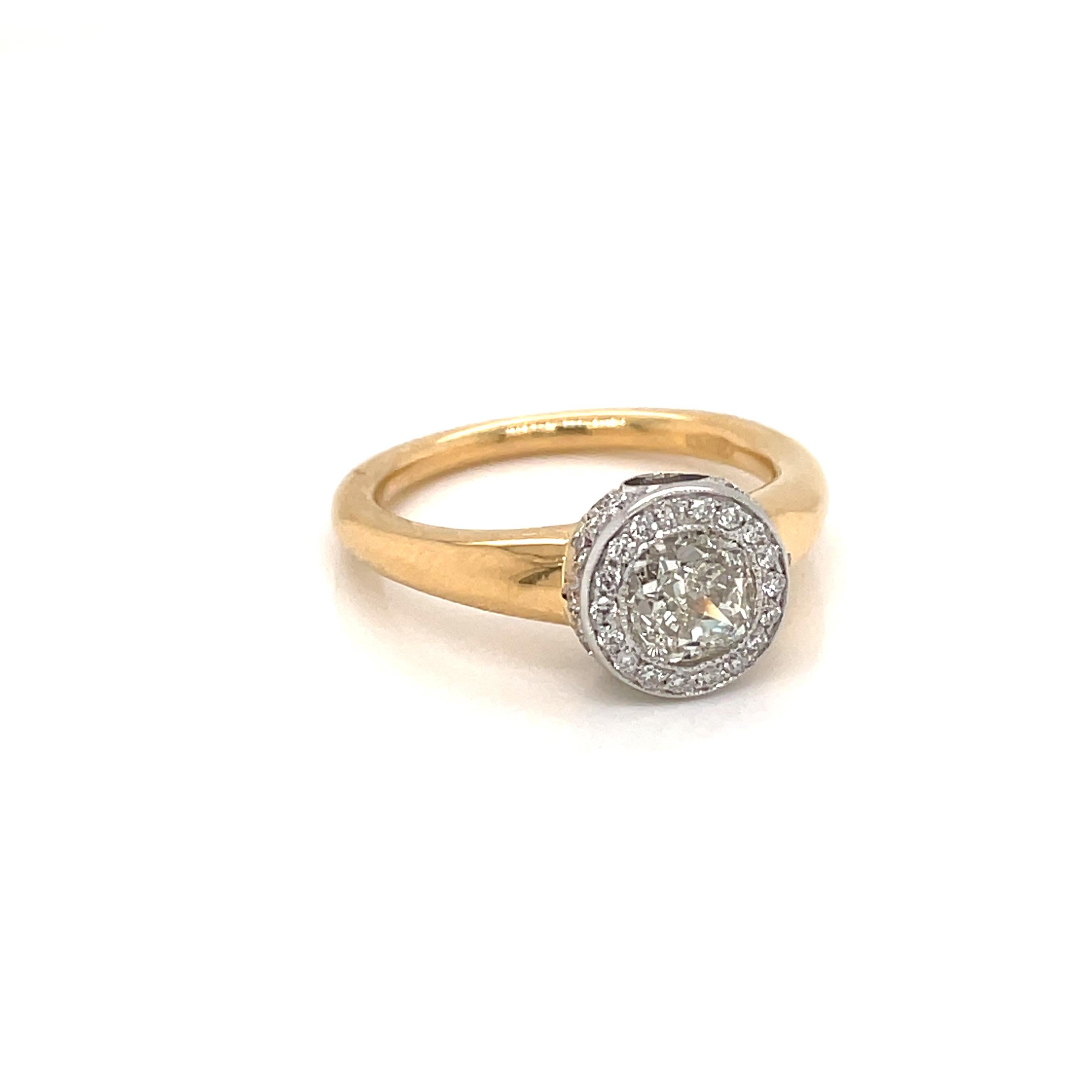 Set with a 1.02 ct. Cushion diamond in a brilliant white and yellow 18 k gold setting, it has a timeless yet modern aesthetic. Designed to be layered and mixed for an effortless look.

The Diamond is graded I color Vs1. it is accompanied by an IGI