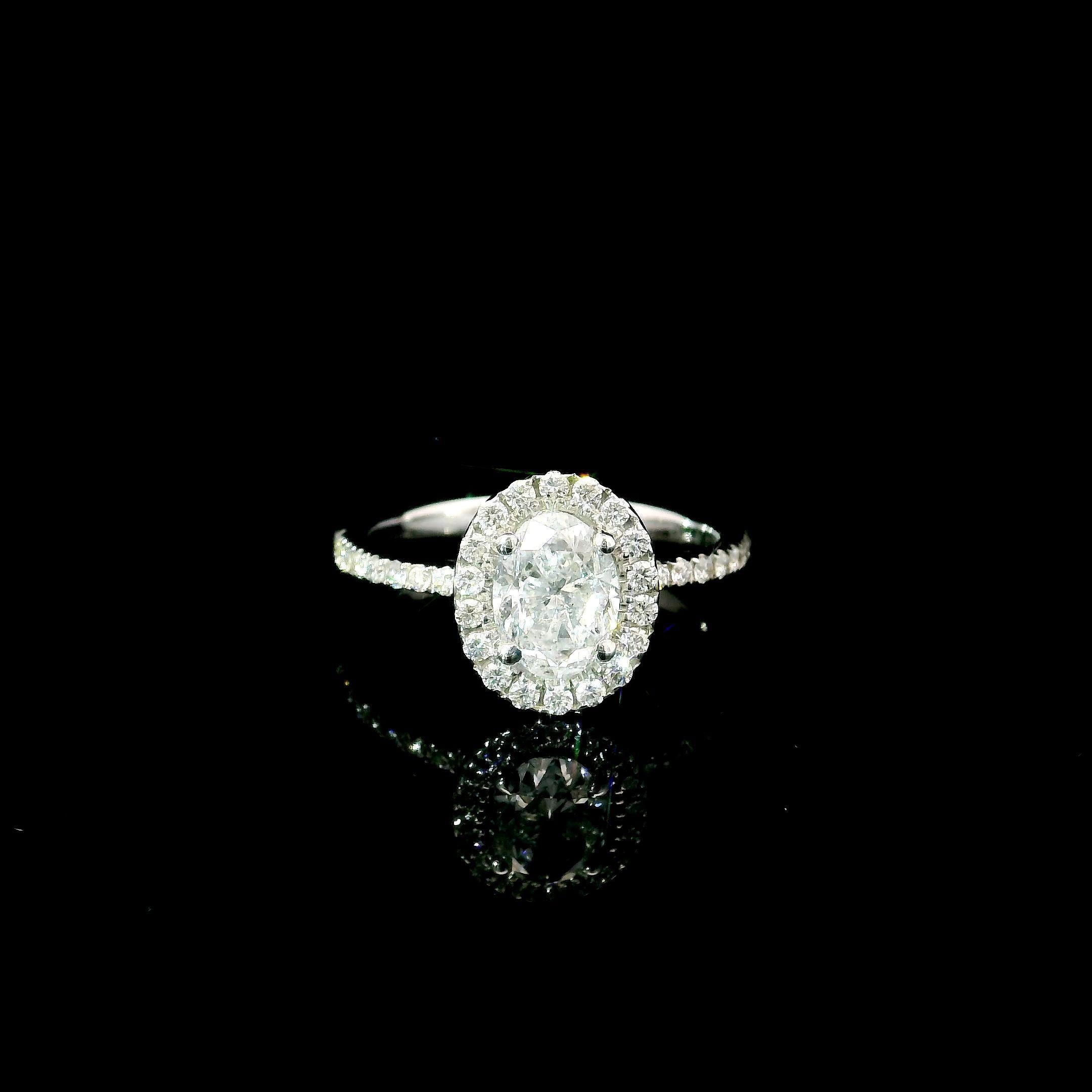 18kt white gold ring with diamonds
  
  Gold colour & karat: White gold 18kt
  Weight: 4.16 grams
  
  Set with-
  Stone type: Diamonds
  Shape: Oval
  Carat: 1.00
  Colour: G Colour 
  Clarity: SI2
  
  Surrounding Stones: Diamonds
 1) White