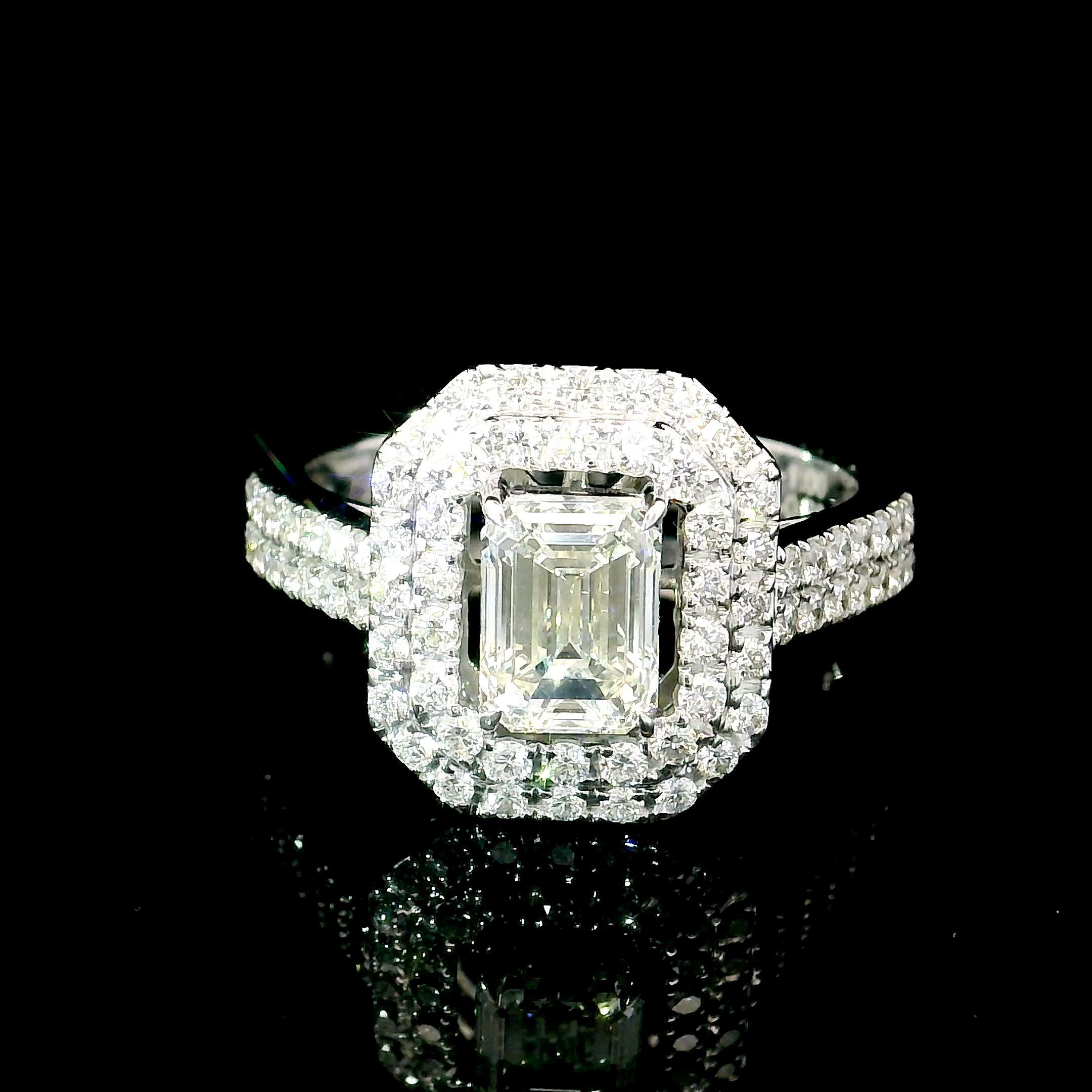 18kt white gold ring with diamonds

  Gold colour & karat: White gold 18kt
  Weight: 5 grams
  
  Set with-
  Stone type: Diamonds
  Shape: Emerald
  Carat: 1.00 ct
  Colour: H
  Clarity: VS2
  
  Surrounding Stones: Diamonds
 1) White Diamonds
 