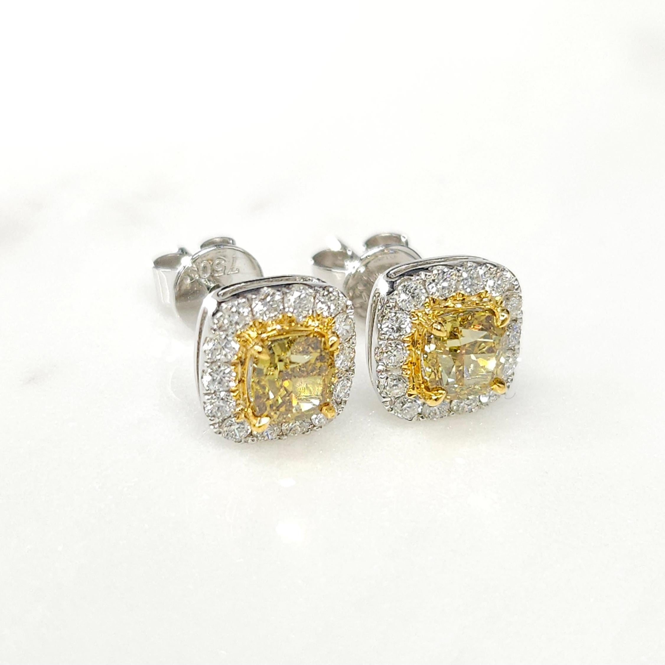 Prepare to be captivated by these enchanting IGI Certified 1.00 Carat Fancy Intense Yellow Diamond Earring Studs. Exuding elegance and radiance, these exquisite earrings feature cushion-shaped yellow diamonds that have been certified by IGI,
