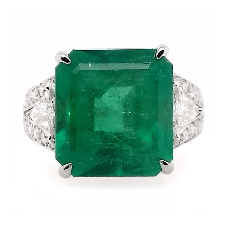 Elevate your elegance with our Top Crown Jewelry Luxury collection platinum ring, where a majestic emerald-cut intense green 10.18ct Colombian emerald takes center stage, embraced by a cascade of mix-shaped natural diamonds. Make a bold statement of