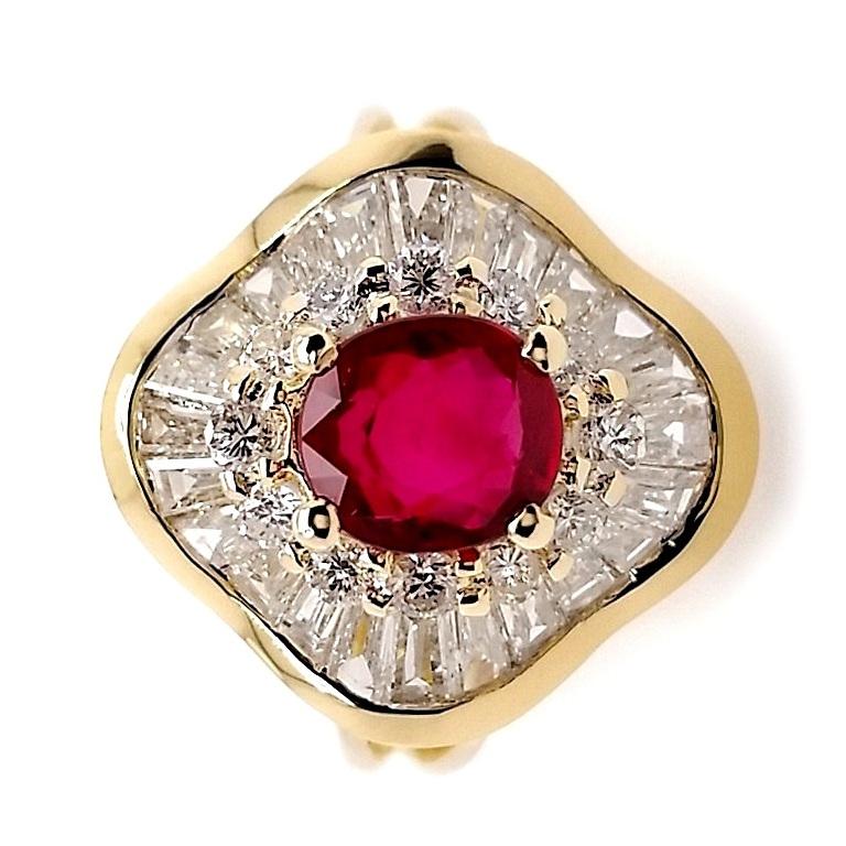 Dazzling in its brilliance, this 18K yellow gold ring, by Top Crown Jewelry, is adorned with captivating allure. The centerpiece is a mesmerizing 1.01-carat oval fine-color ruby, surrounded by a lavish halo of 1 carat sparkling natural diamonds.