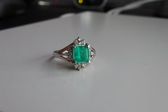 IGI certified 1.04Ct Colombian Emerald Ring with Natural diamonds in Platinum