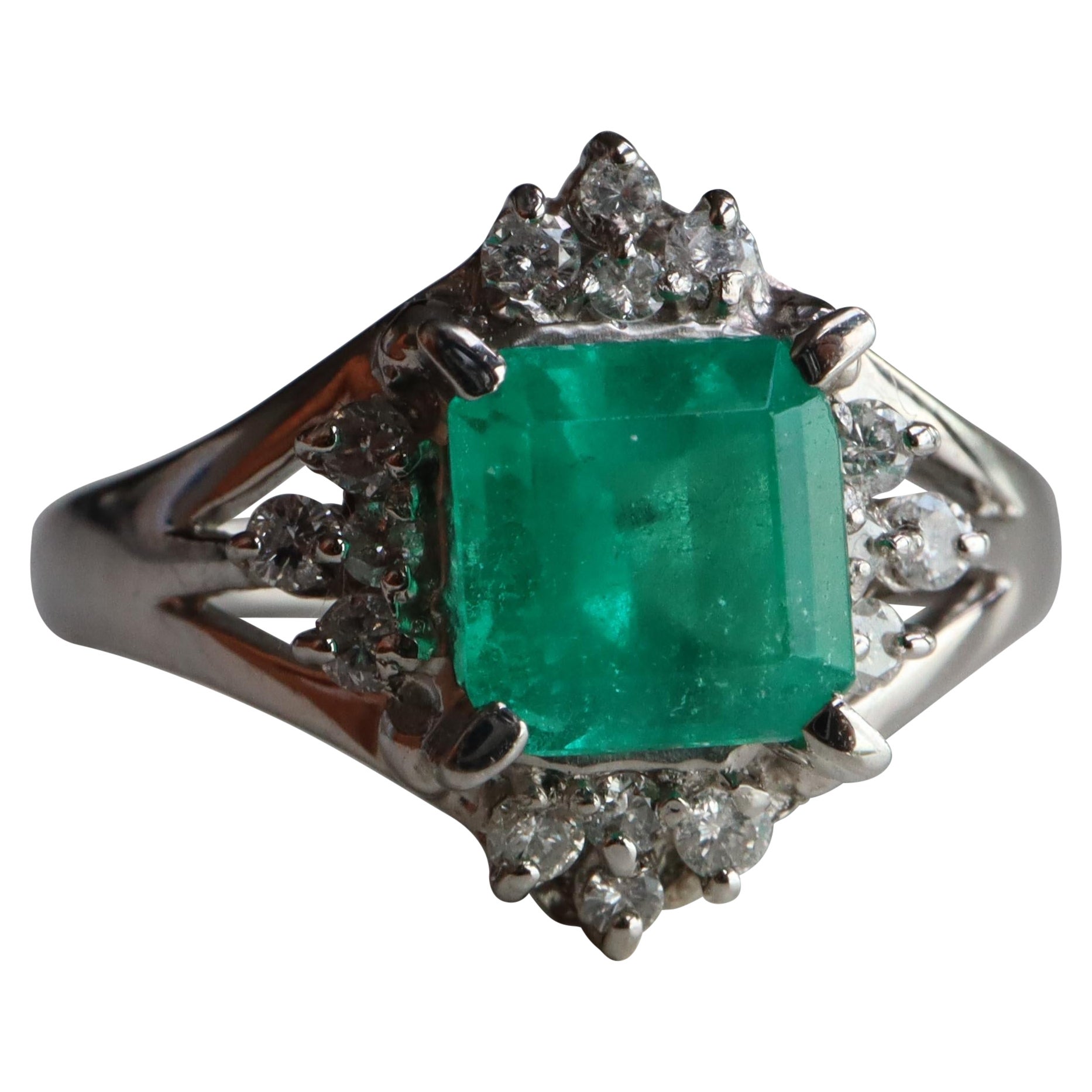 IGI certified 1.04Ct Colombian Emerald Ring with Natural diamonds in Platinum