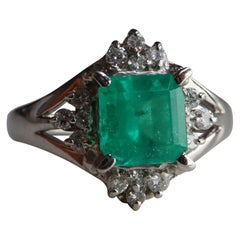 IGI certified 1.04Ct Colombian Emerald Ring with Natural diamonds in Platinum