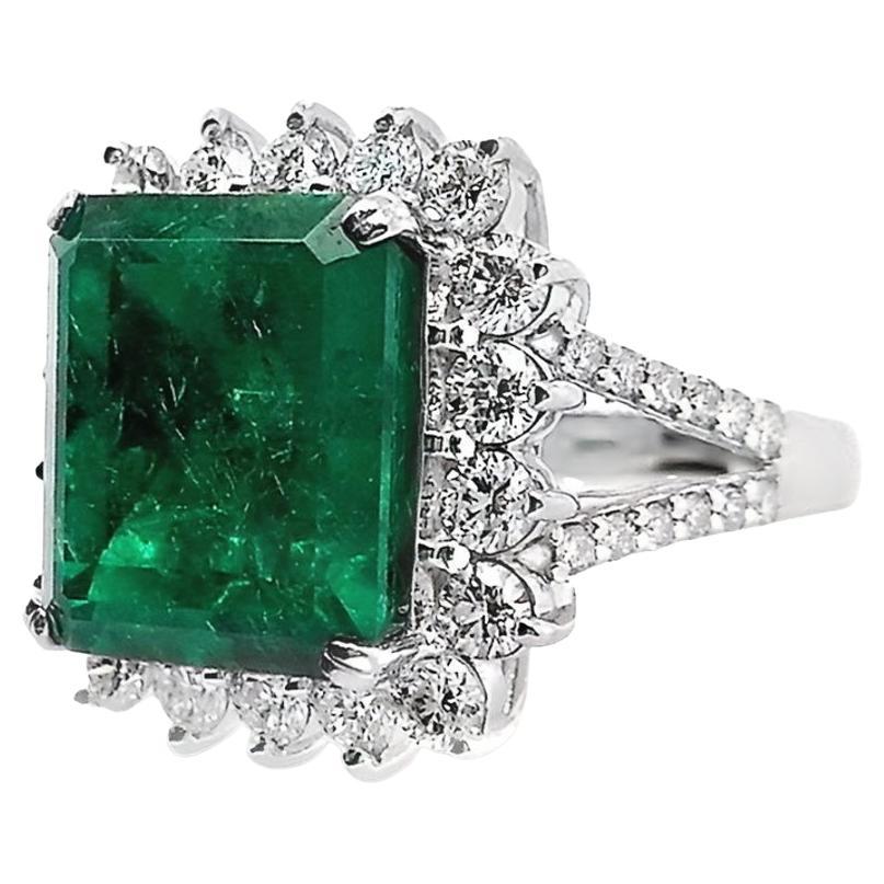 This is a majestic intense bluish-green emerald ring decorated with round brilliant-cut natural sparkling diamonds, so glamourous and timeless!
This magnificent ring has a classic appeal that will never go out of style.

This ring is certified by