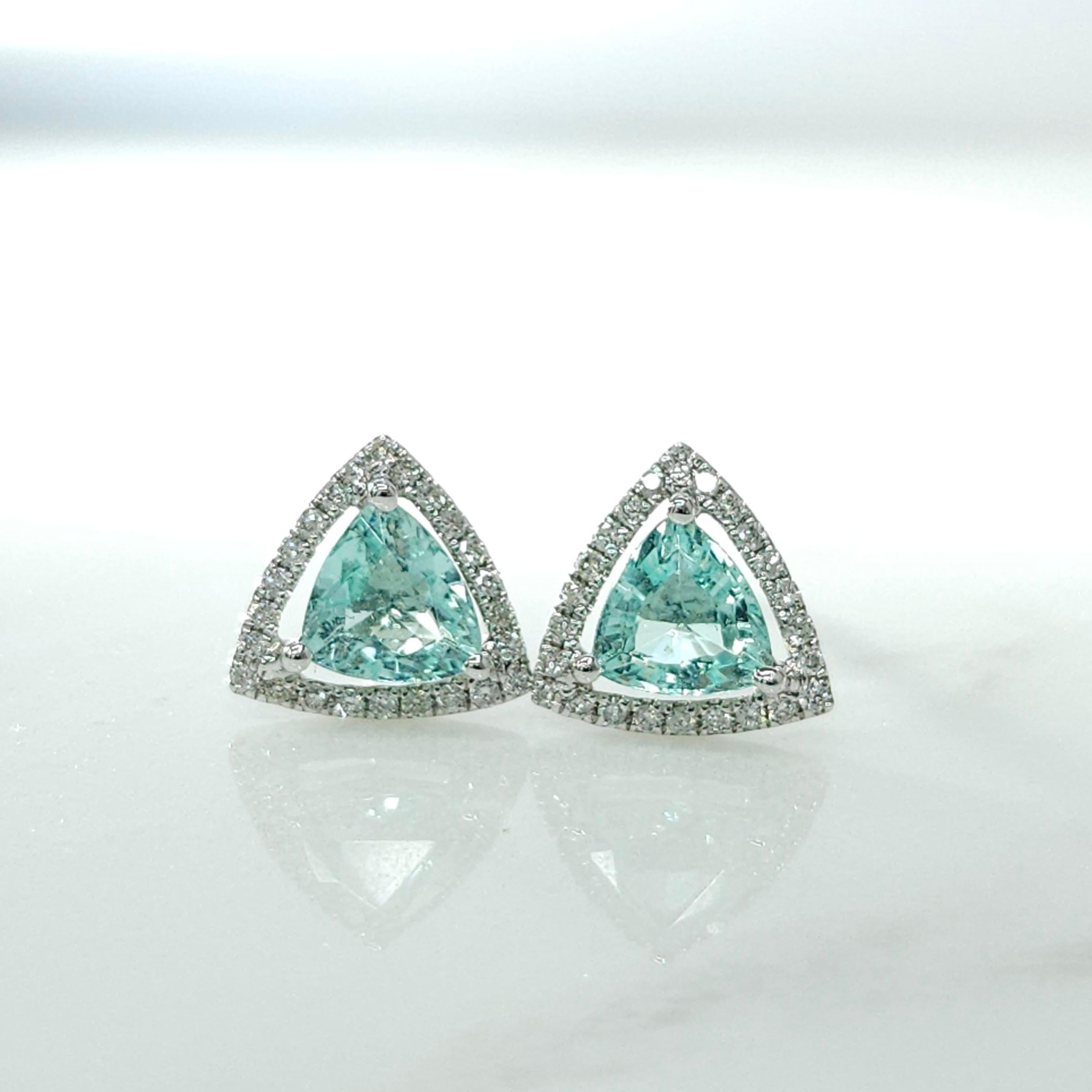 Elevate your jewelry collection with this extraordinary pair of IGI Certified Paraiba and Diamond Earrings crafted in exquisite 18K white gold. These earrings are a true testament to luxury, combining the allure of Paraiba gemstones with the