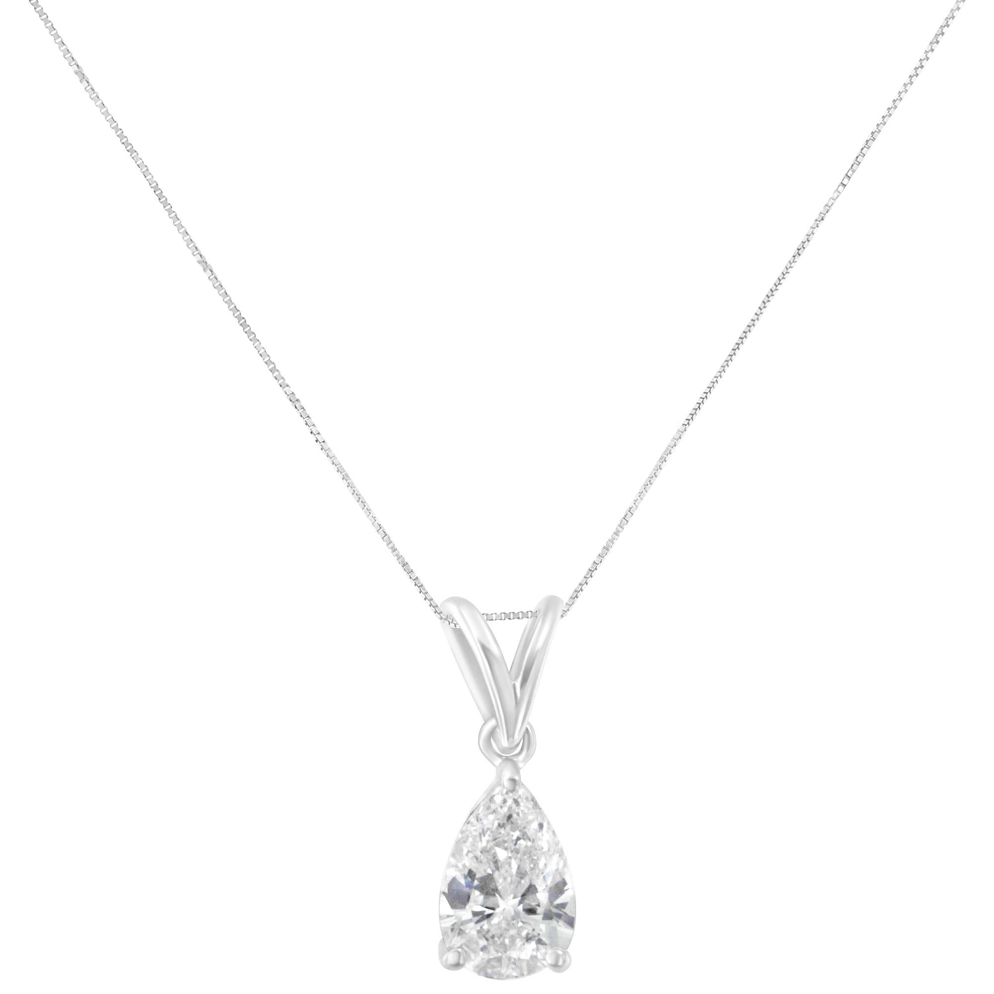 This timeless design features a pear cut diamond hanging from a delicate chain. A classic design to last a lifetime. It is crafted in 10 karat white gold and has a total diamond weight of 1/2 carats. This beautiful necklace includes 18” rolo chain