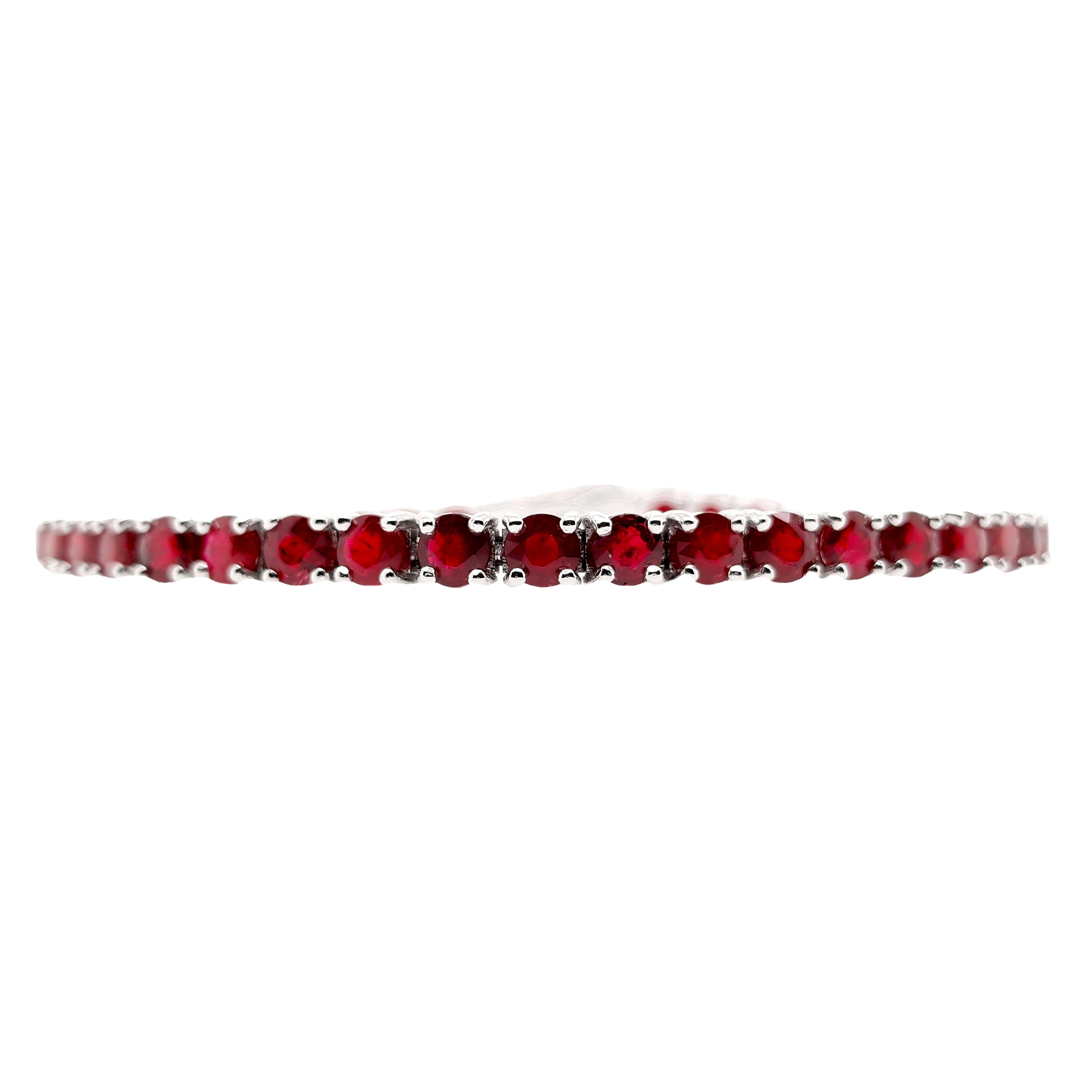 Elegant 14Kt White Gold Bracelet showcasing 11.03ct of Natural Rubies, accompanied by IGI certification. Set with 43 round mixed-cut stones, the rubies display a mesmerizing range of deep purplish-red to deep red tones, with natural inclusions and