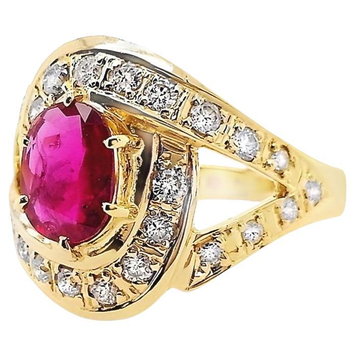 This chic ring, from the house of Top Crown Jewelry collection, is a unique piece of jewelry.
The center stone is a natural ruby, oval shape with beautiful intense purplish red color, accented by 100% natural round sparkling diamonds.

This ring is
