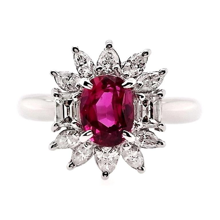 Unveil the allure of nature's masterpiece with this untreated ruby of rare brilliance, vivid-purplish-red color, set in a distinguished design. Paired with brilliant natural diamonds and set on a platinum ring, this red gem exudes timeless elegance.