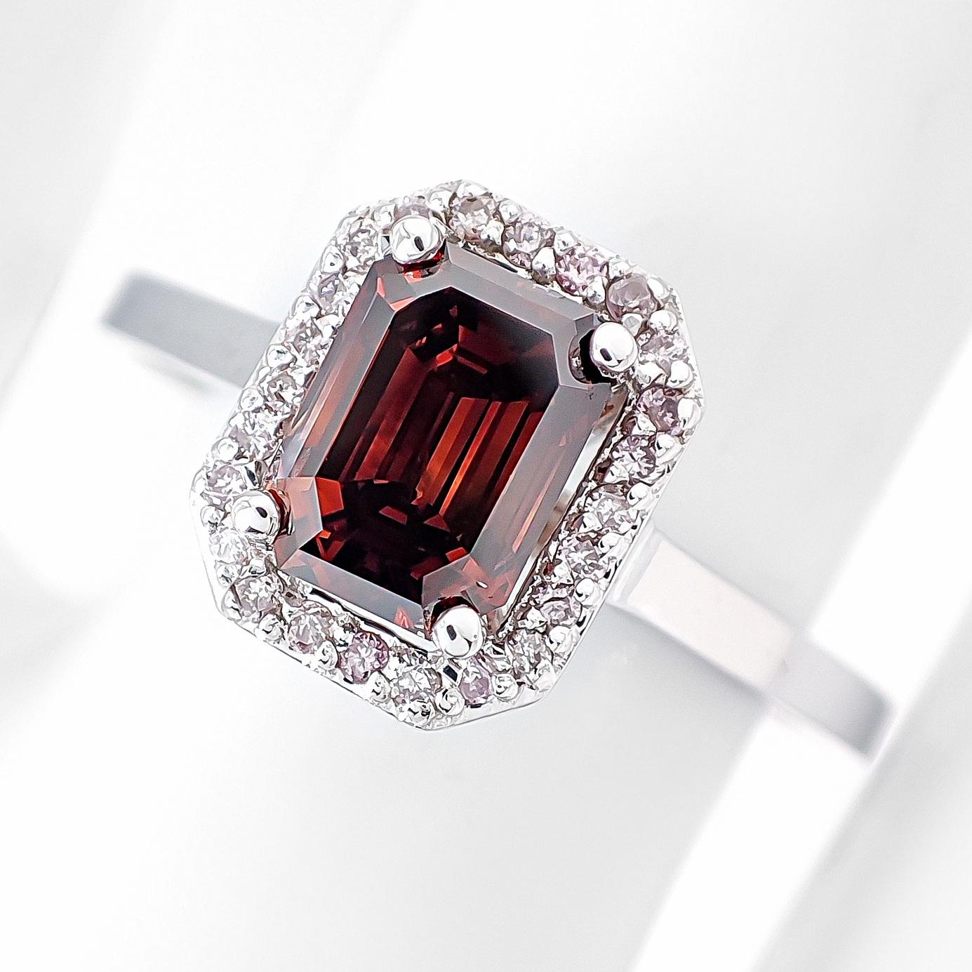 FOR U.S. BUYERS NO VAT NO CUSTOMS FEES

Pink diamonds are extremely unique and rare, ranking as the most special colored diamonds worldwide.

The ring features a stunning center diamond that is a 1.01-carat natural emerald-cut stone with a unique