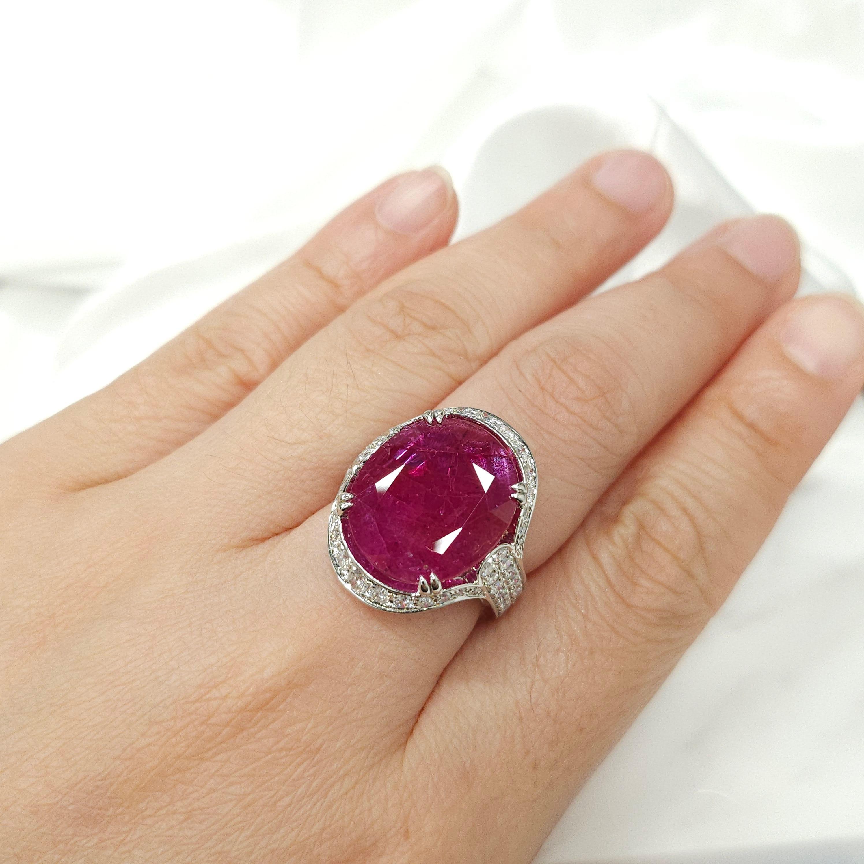 Indulge in the ultimate luxury with this IGI Certified 11.39 Carat ruby ring, an exquisite masterpiece that combines exceptional gemstones and modern design. With its deep purplish red color and oval shape, this rare and extraordinary ruby