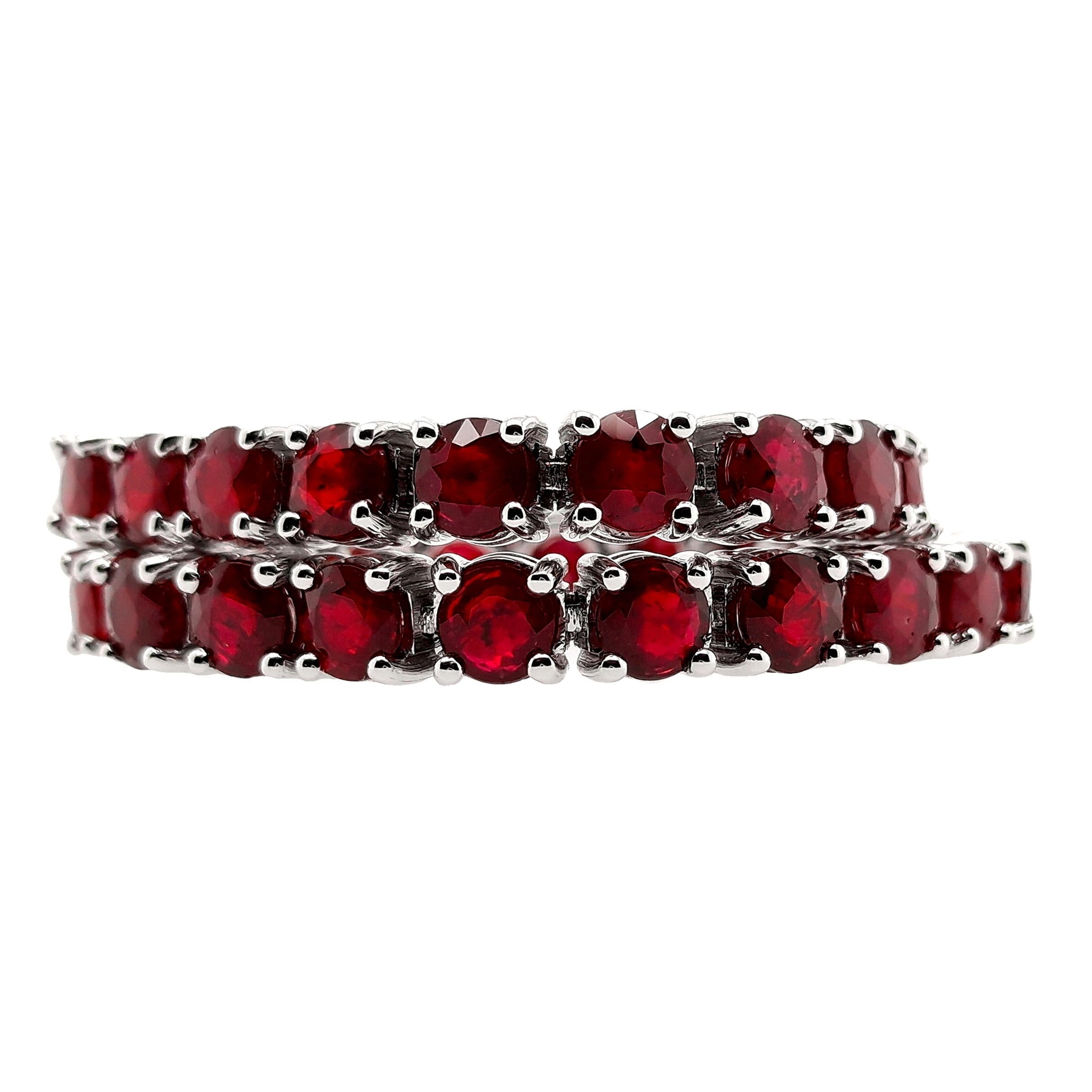 Exquisite 14Kt White Gold Bracelet adorned with 11.46ct of Natural Rubies, certified by IGI. This luxurious piece features 39 round mixed-cut rubies, each showcasing a captivating deep purplish-red to deep red hue, enhanced by expert heating