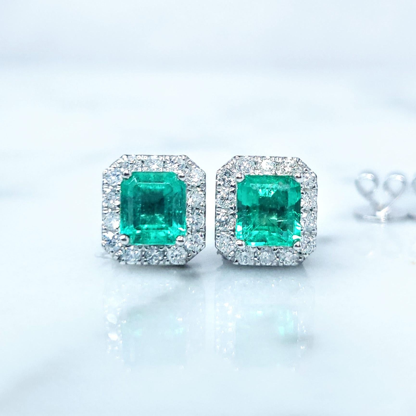 These captivating 18k white gold earrings whisper tales of the verdant Colombian emerald mines, where nature's artistry unfolds in shades of intense bluish-green. Two emerald-cut emeralds, totaling 1.17 carats, are the heart of this elegant pair.